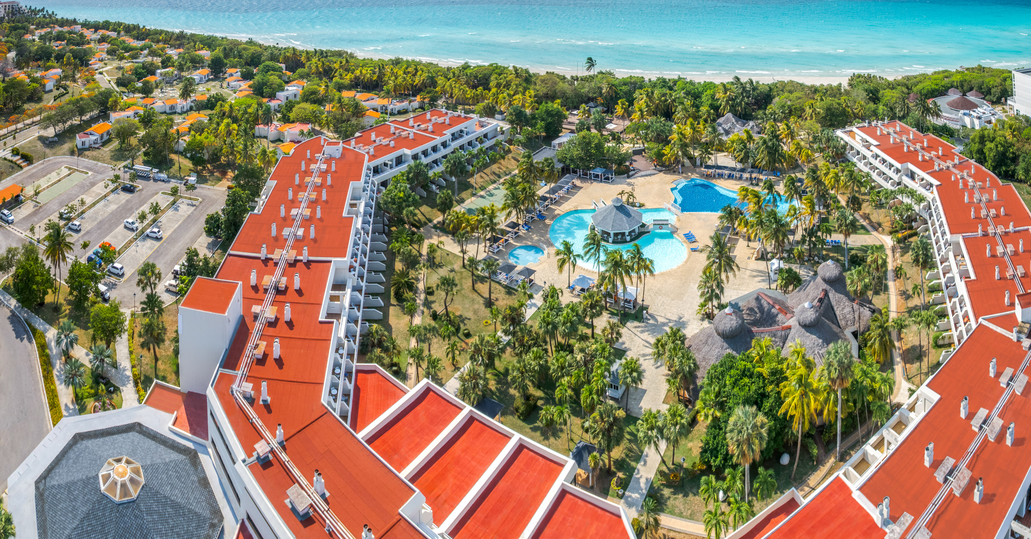 a resort with a pool and trees