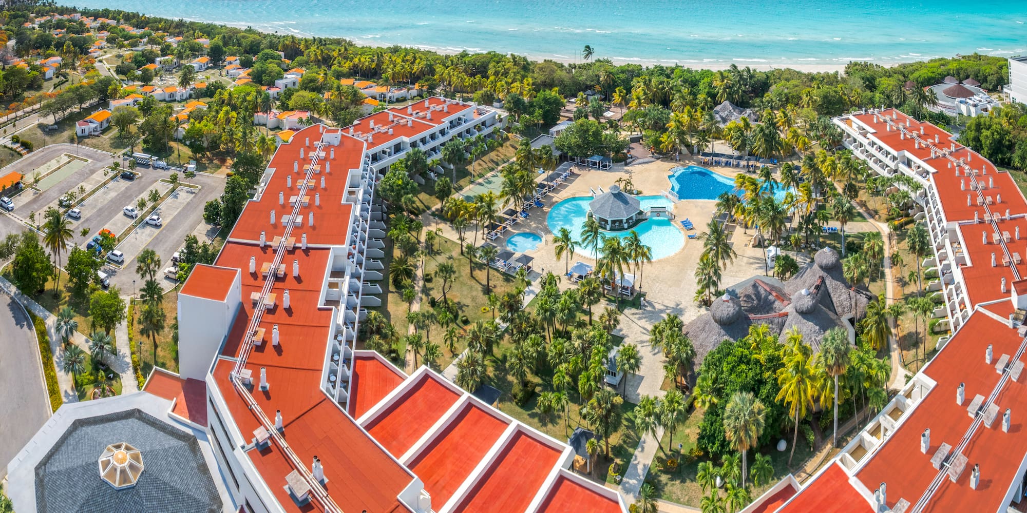 a resort with a pool and trees