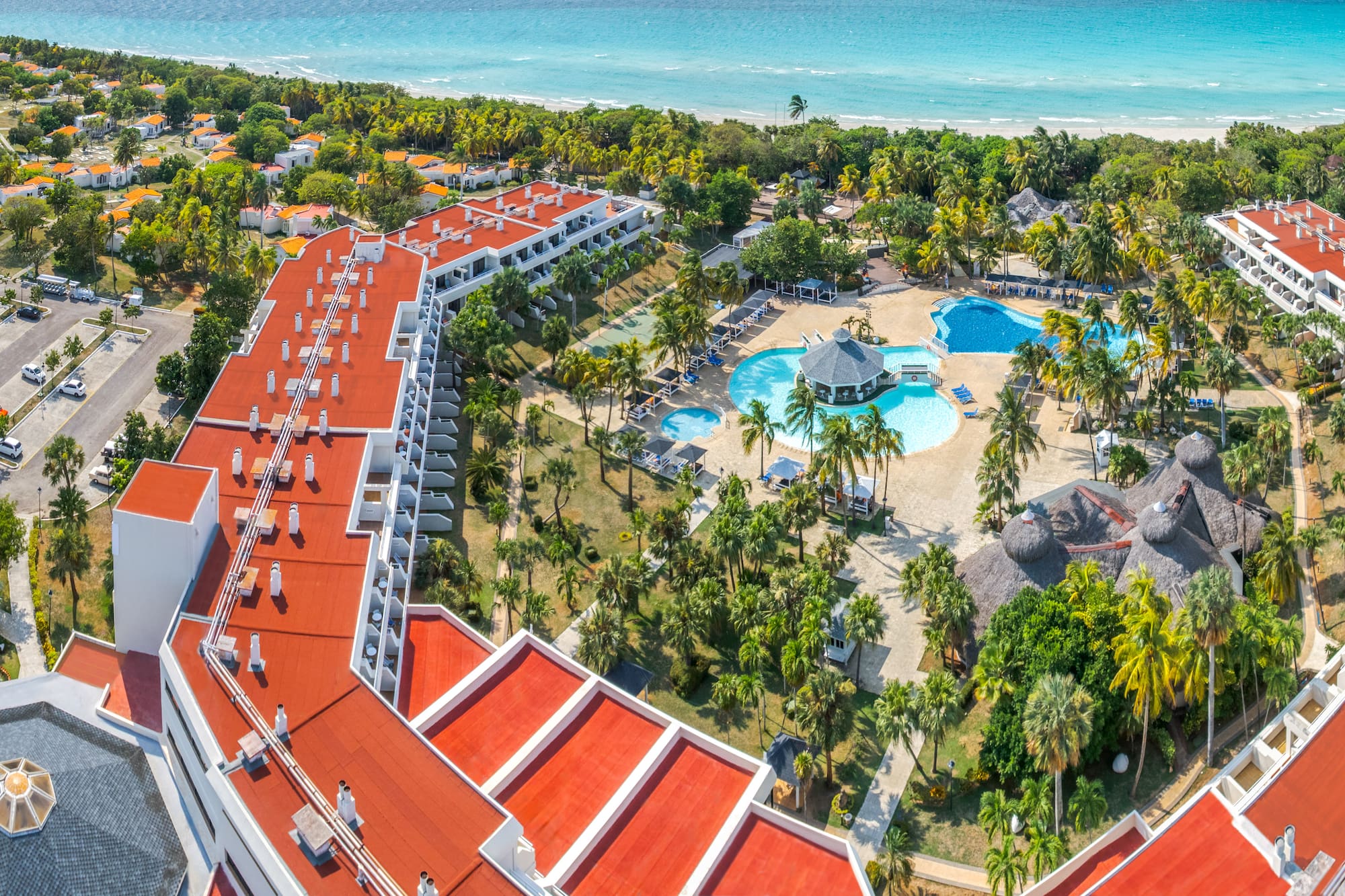 a resort with a pool and trees