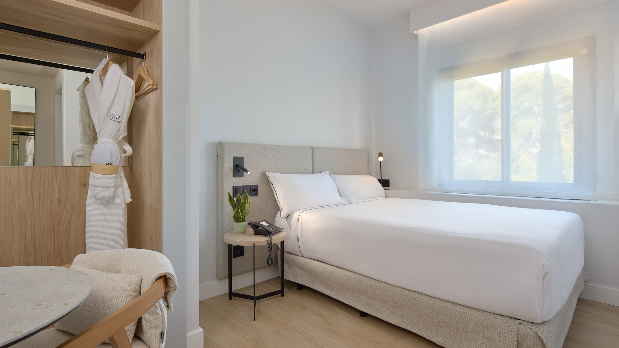 a bedroom with a bed and a shelf