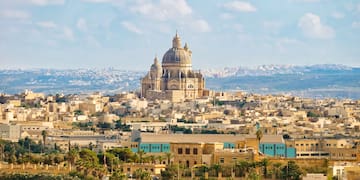a large building on a hill