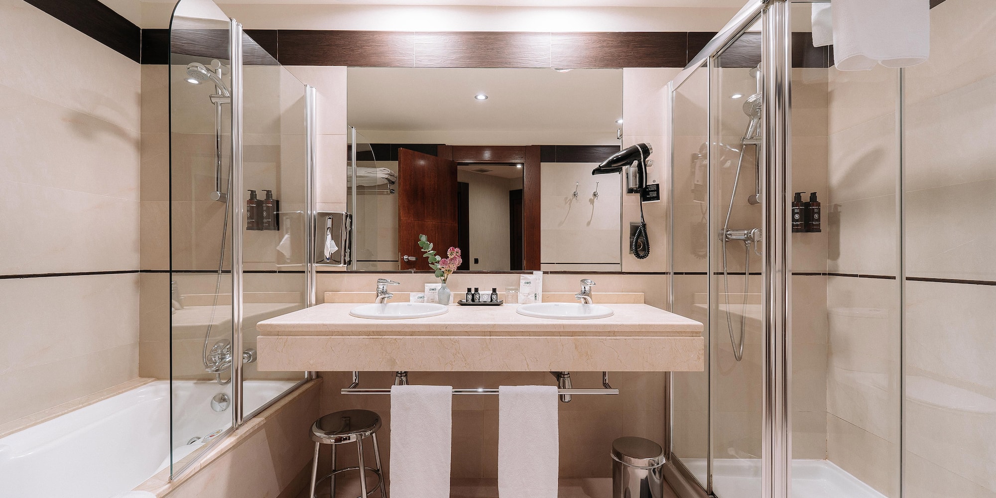 a bathroom with a shower and sink