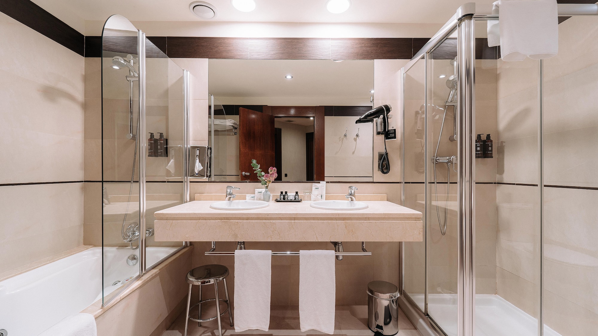 a bathroom with a shower and sink