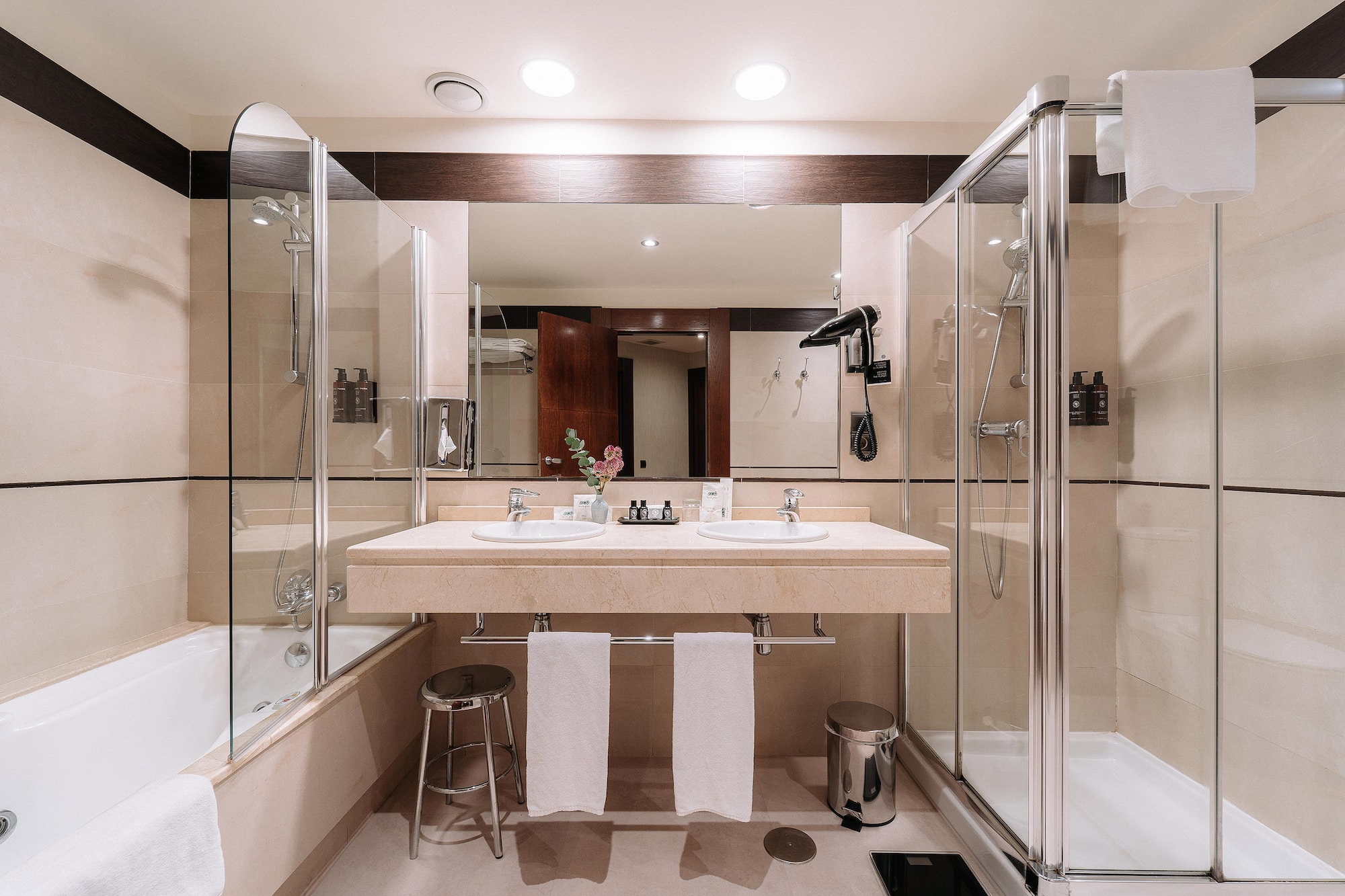 a bathroom with a shower and sink