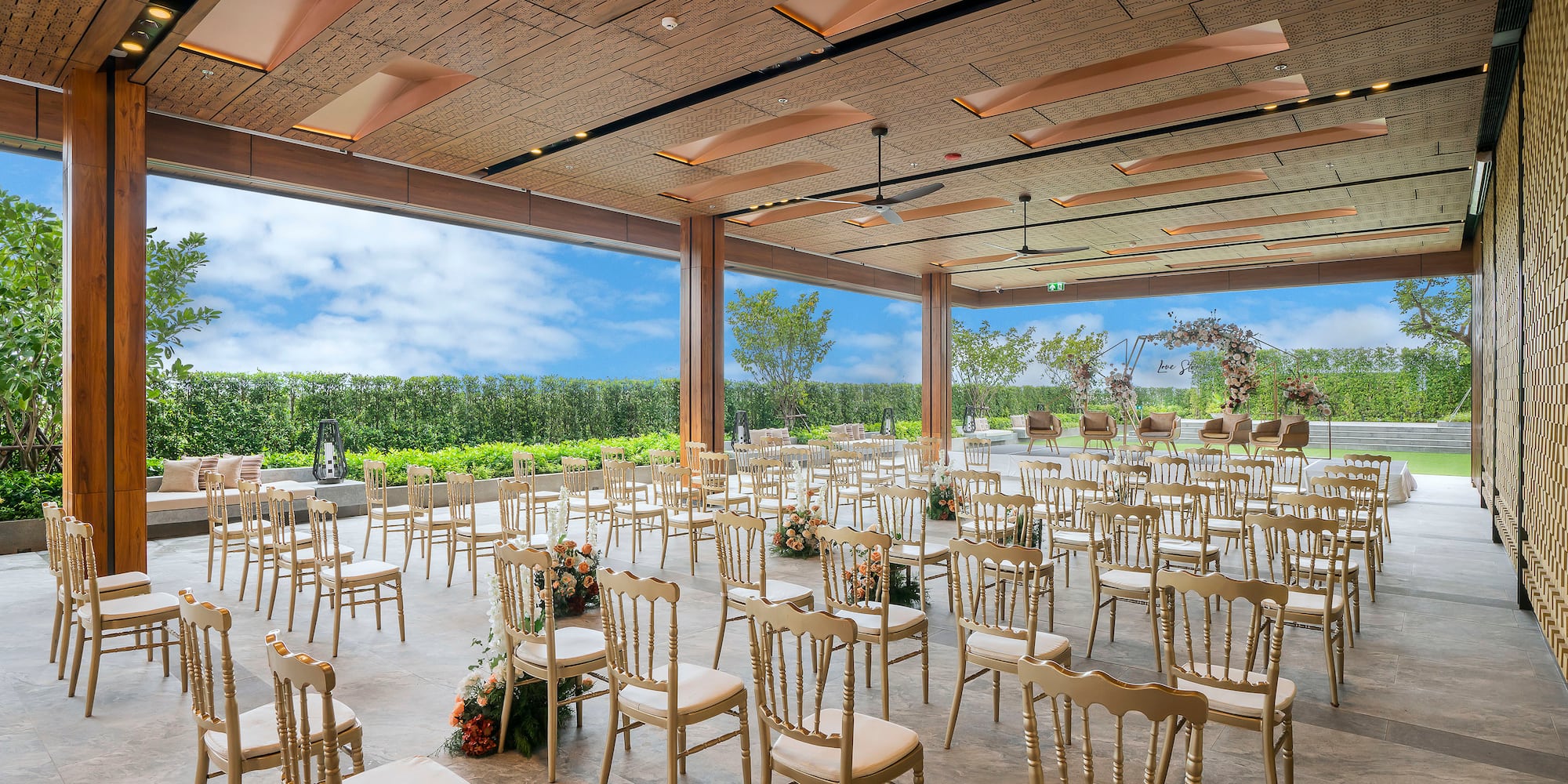 a room with chairs and flowers