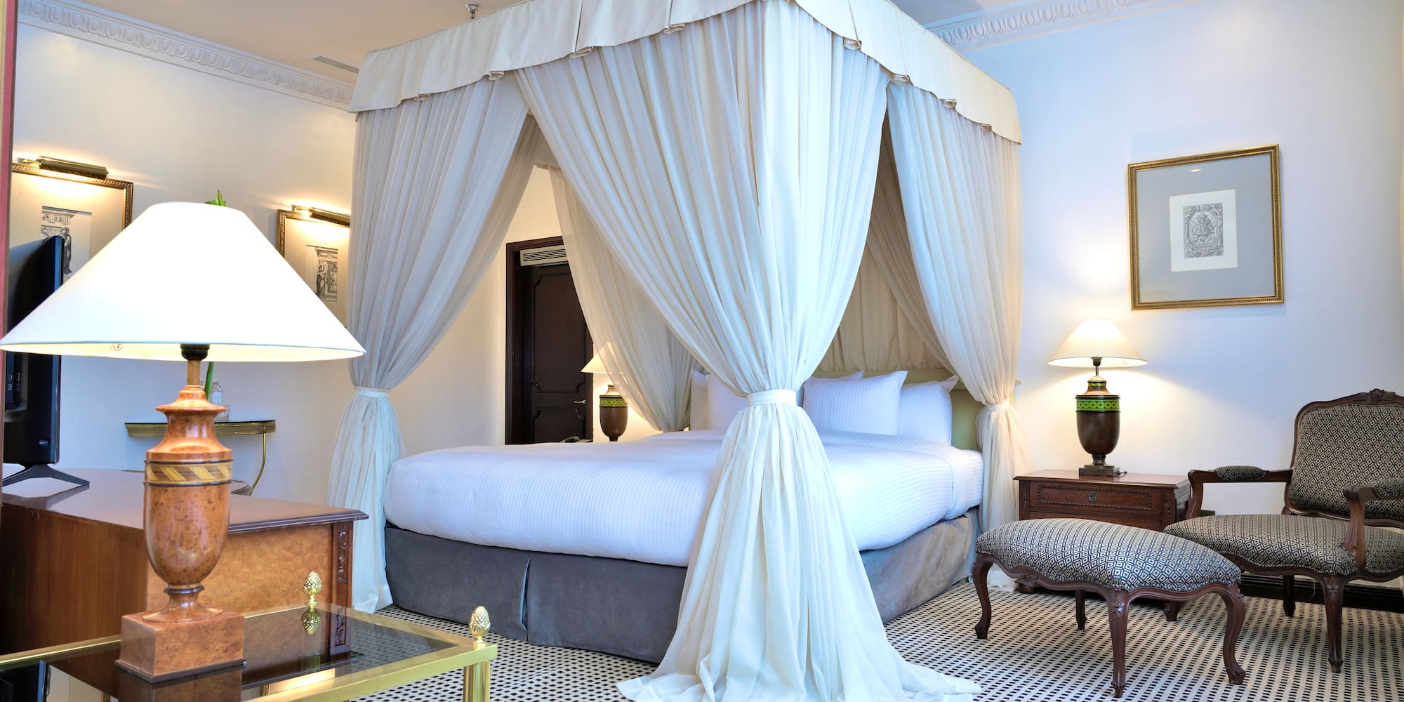 a white canopy bed in a room