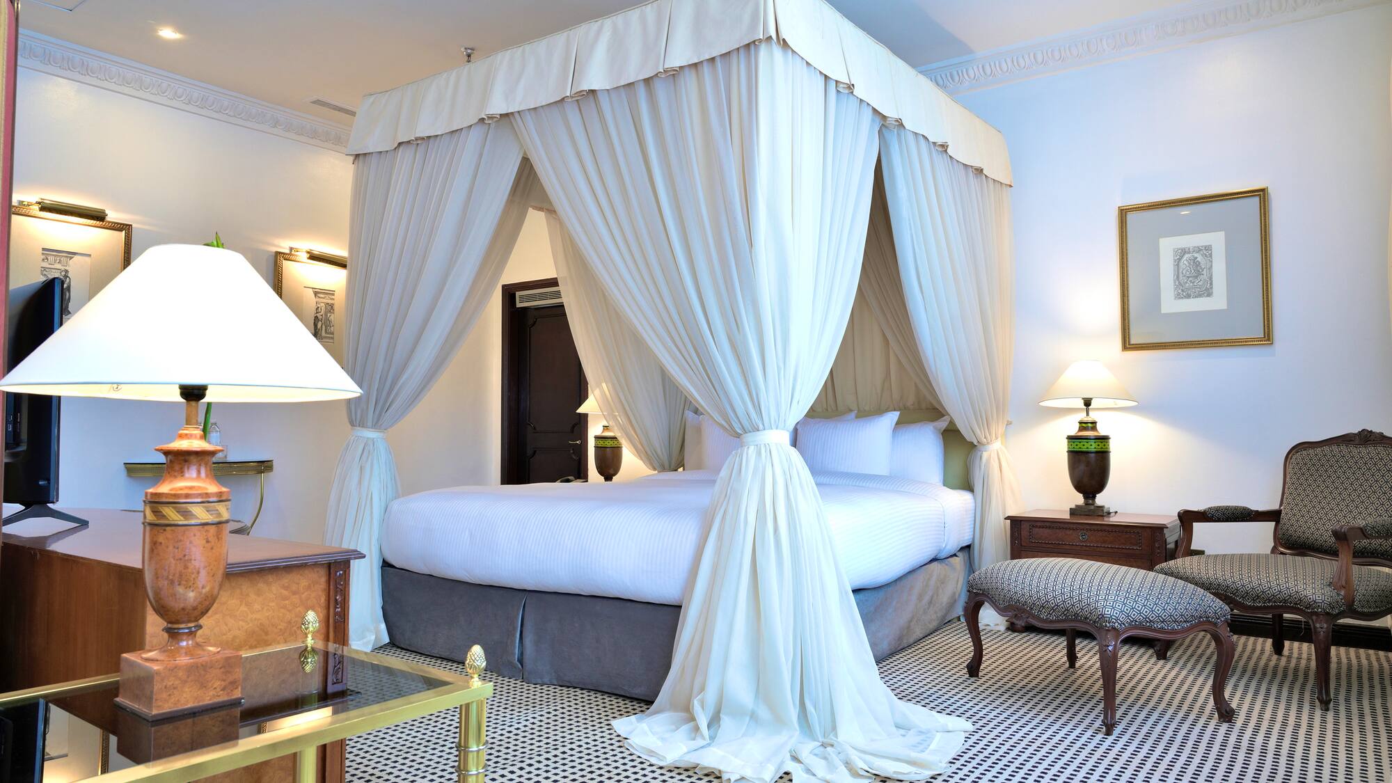 a white canopy bed in a room