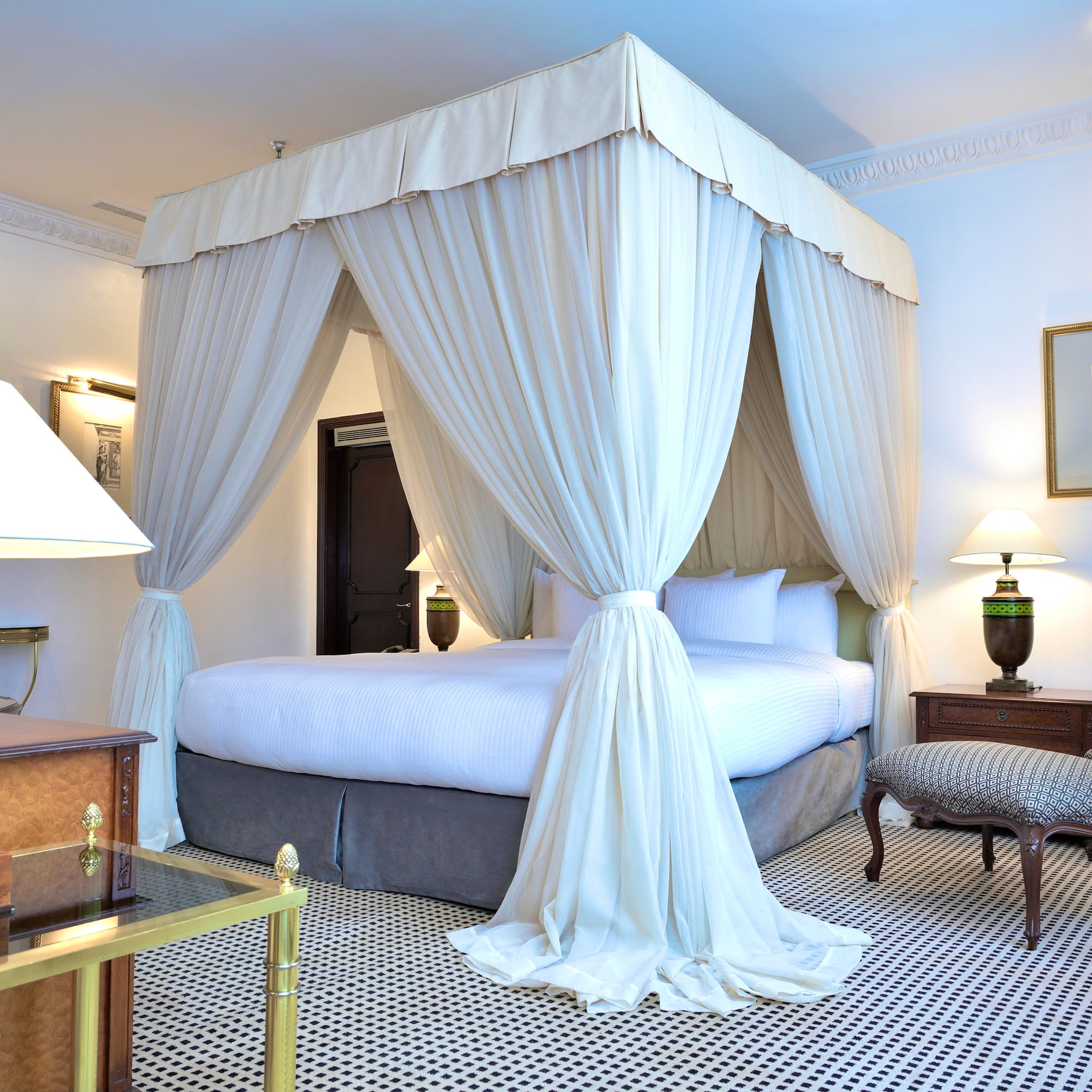a white canopy bed in a room