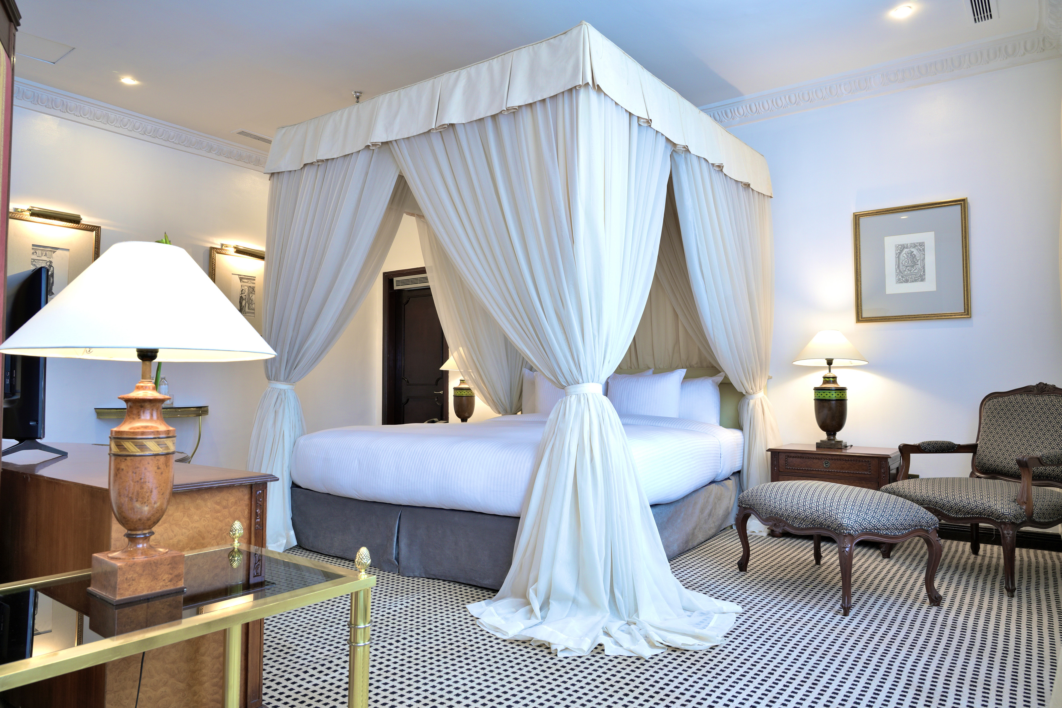 a white canopy bed in a room