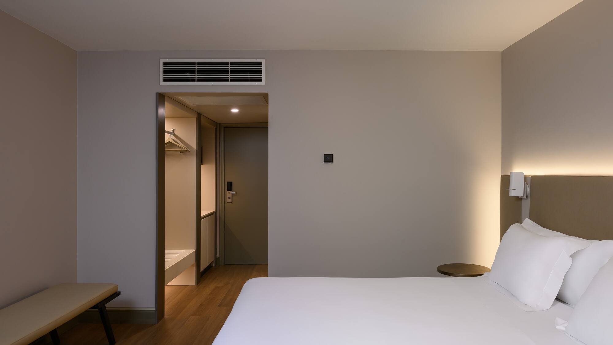 a room with a bed and a shower