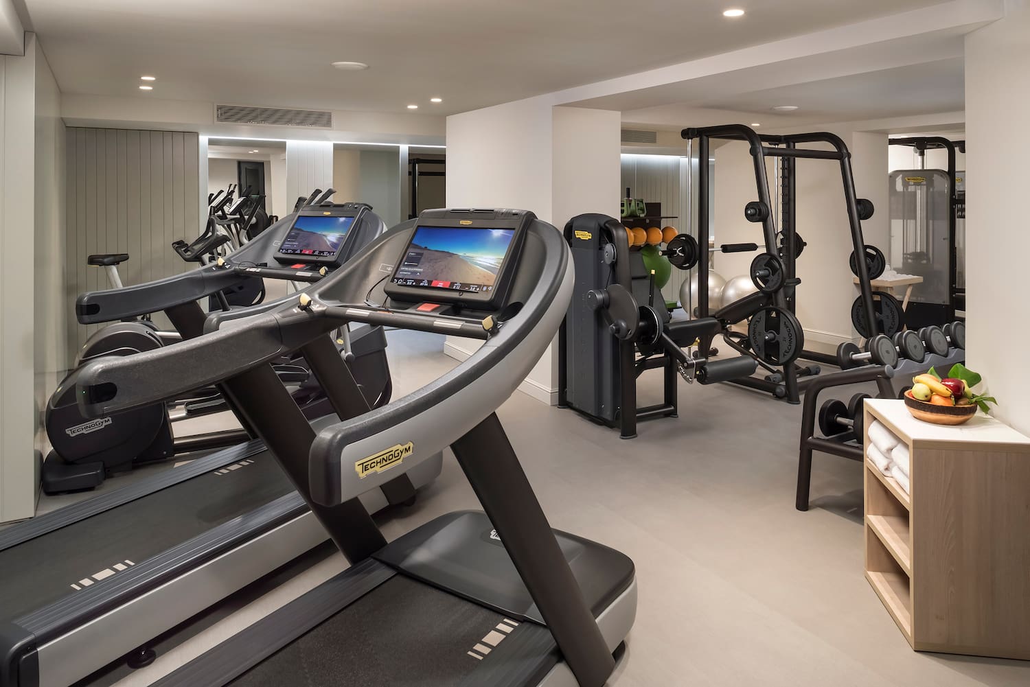 a room with treadmills and exercise equipment