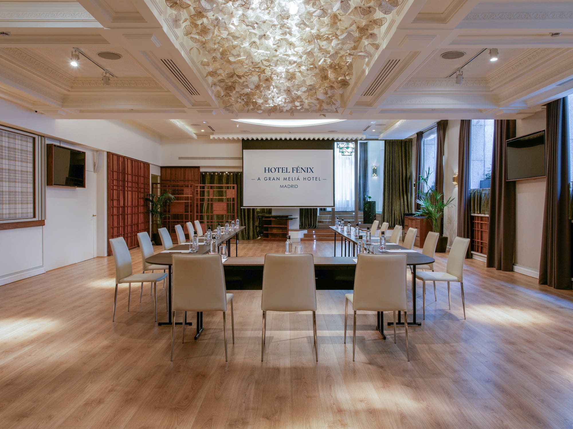 a room with a large table and chairs