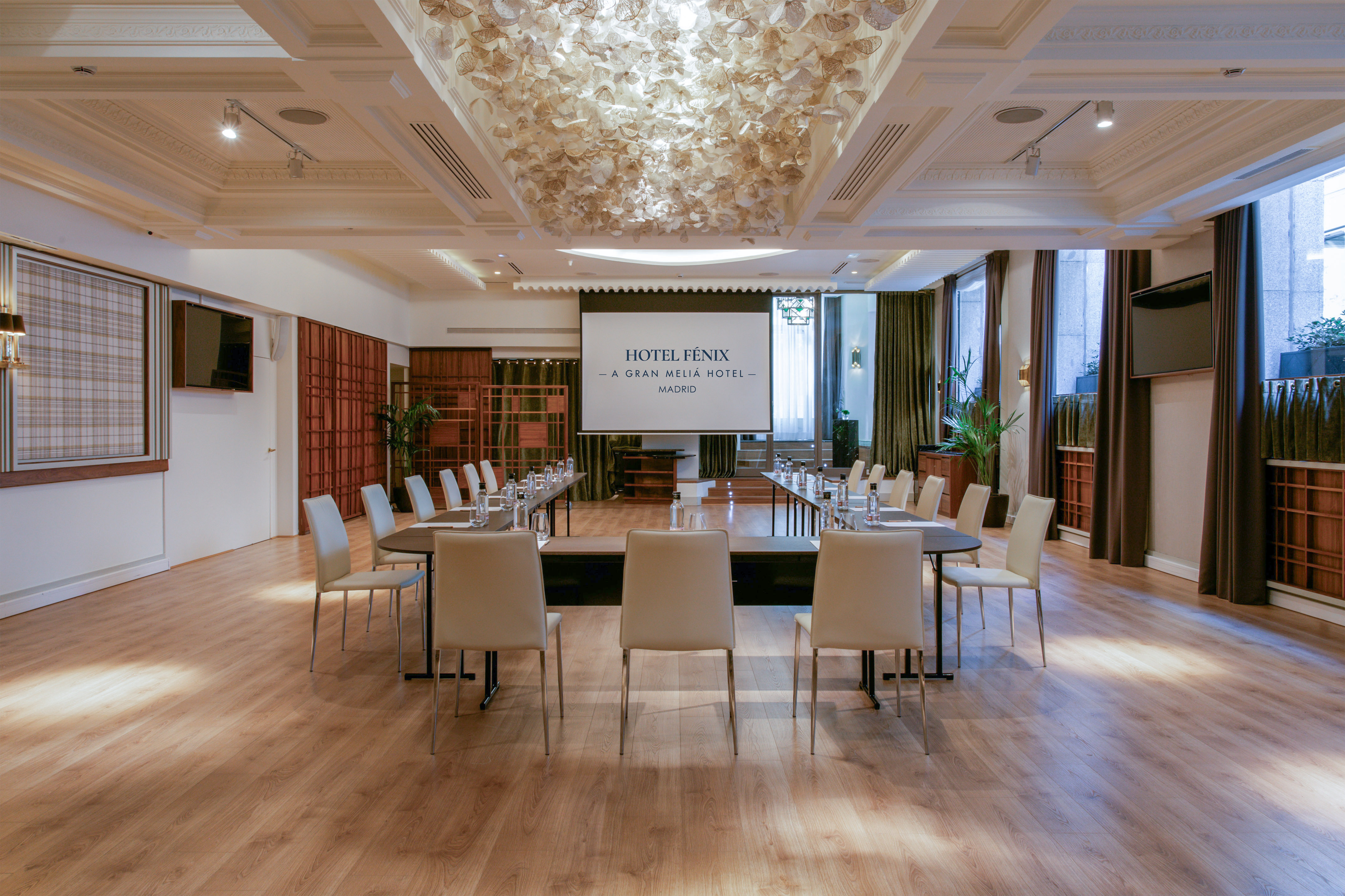 Hotel Fenix Gran Melia Madrid conference room with U-shaped table setup.