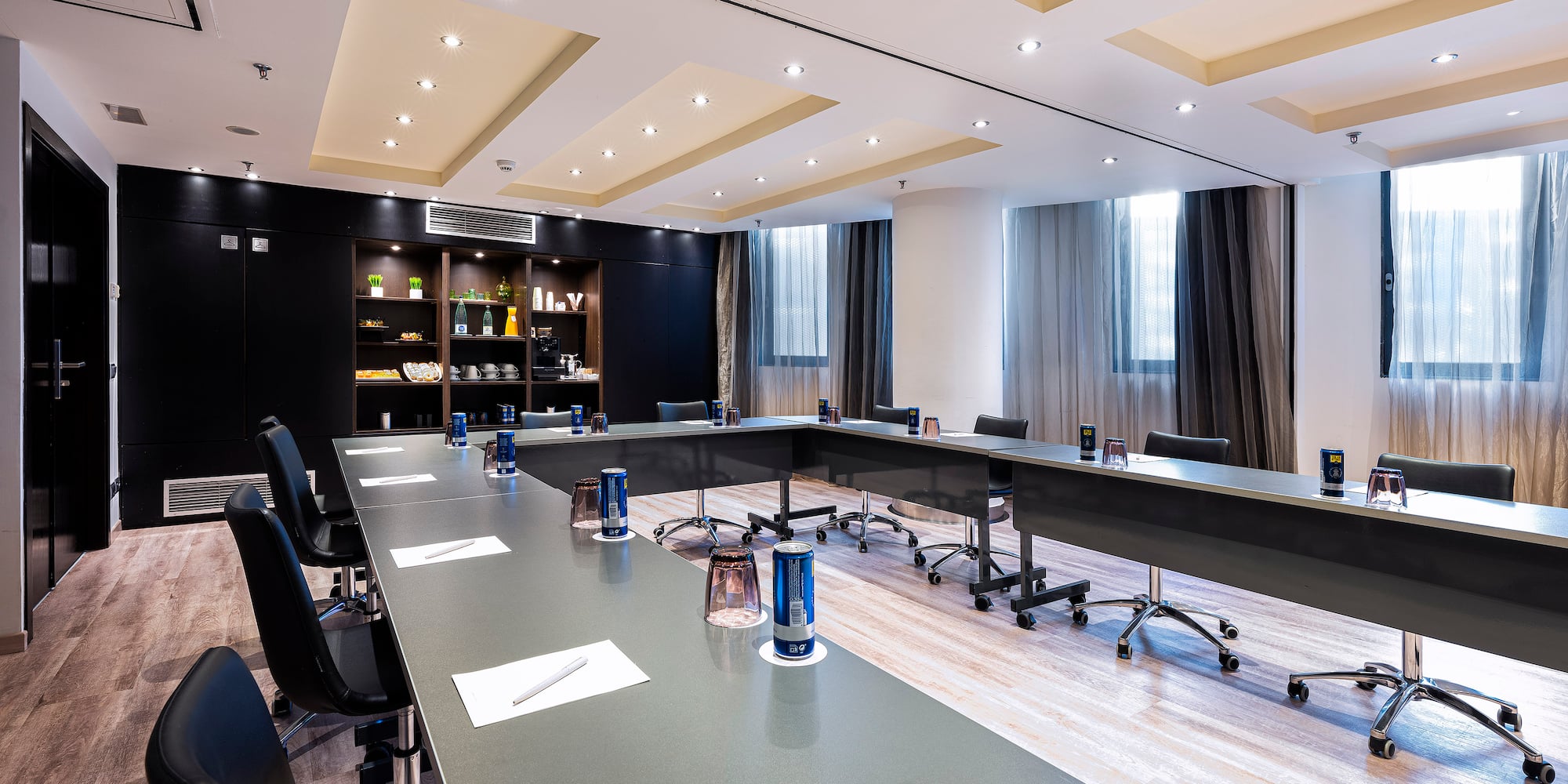 a conference room with a long table and chairs