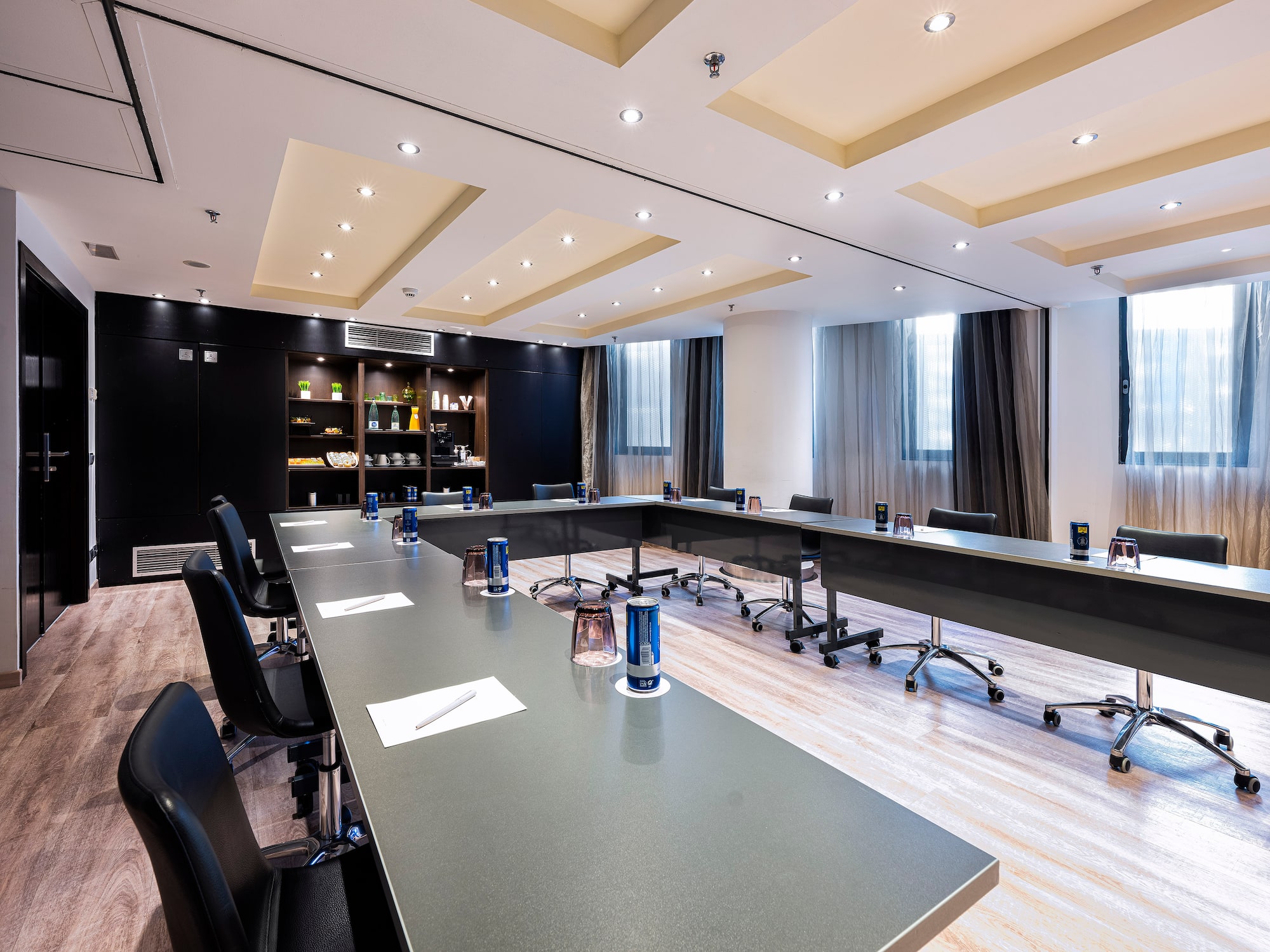 a conference room with a long table and chairs