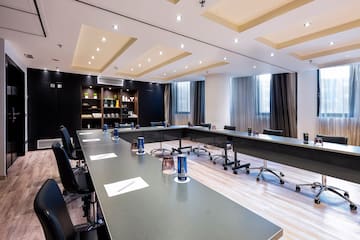 a conference room with a long table and chairs