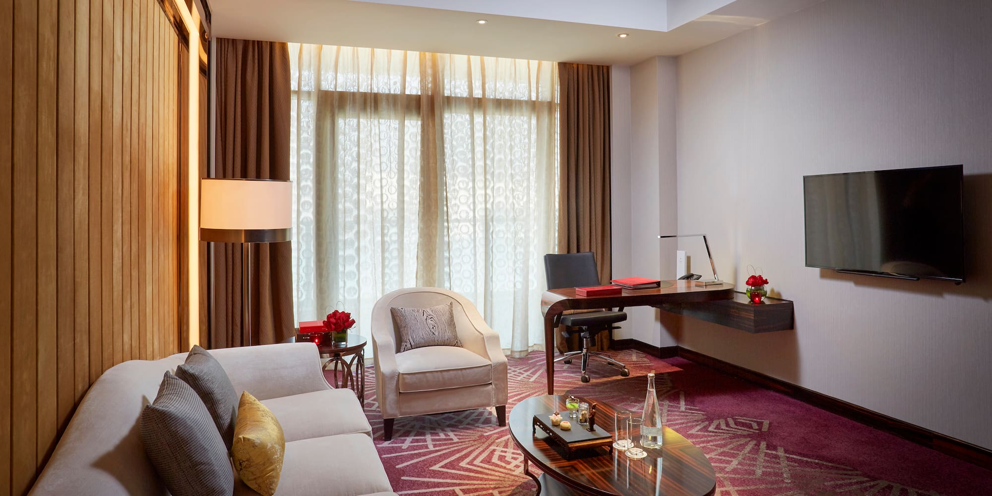 a room with a desk and a couch