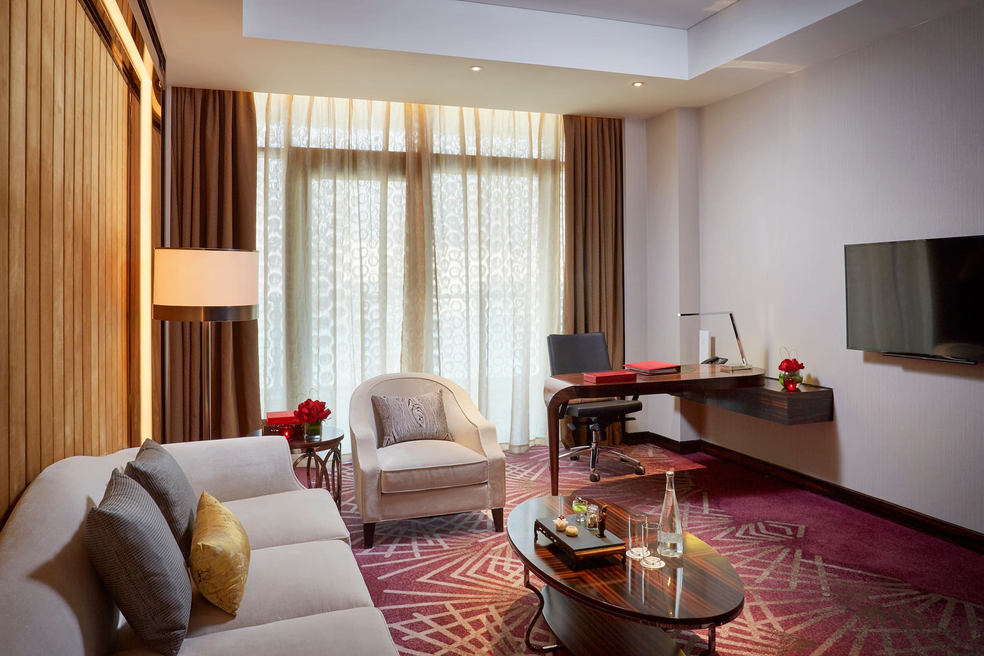 a room with a desk and a couch