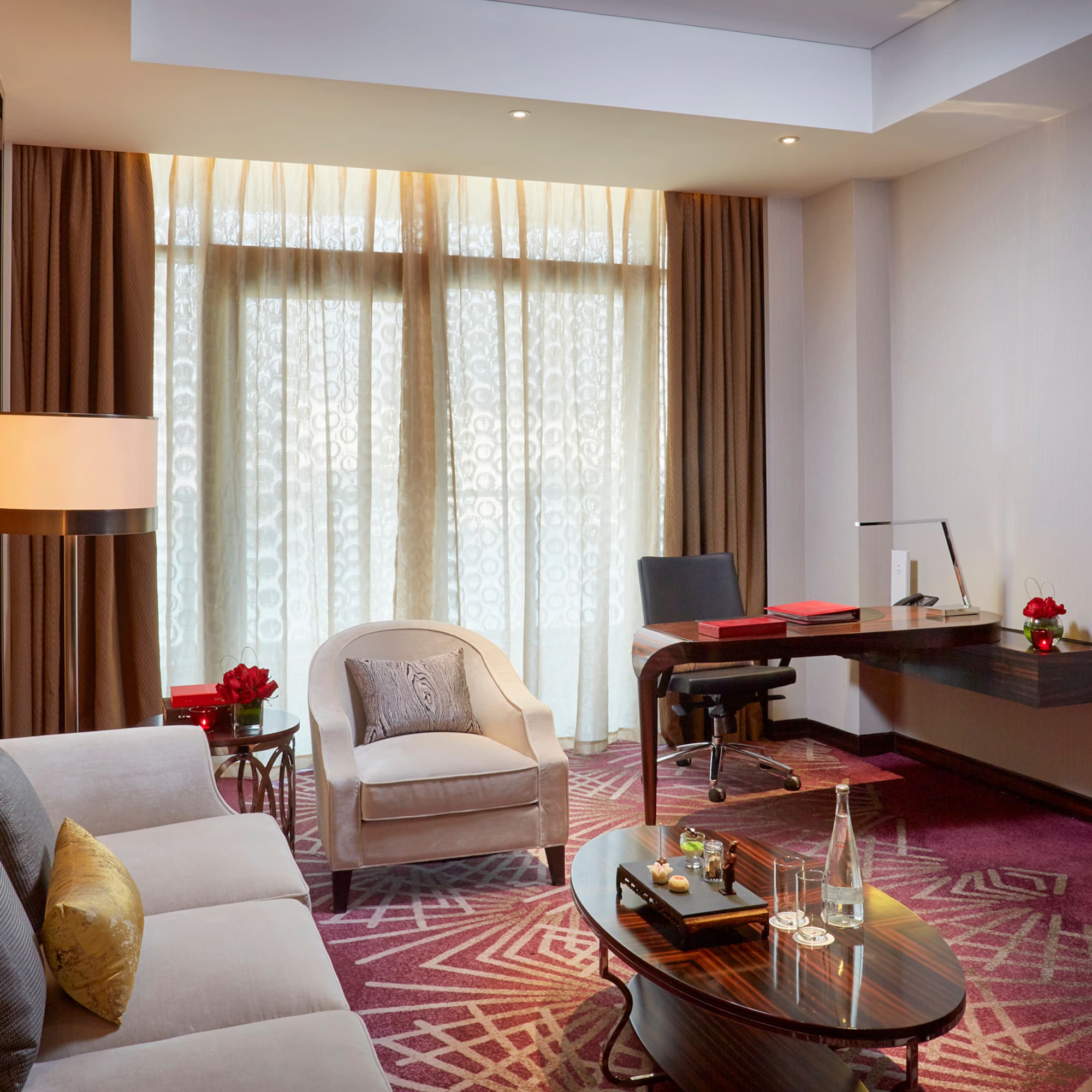 a room with a desk and a couch