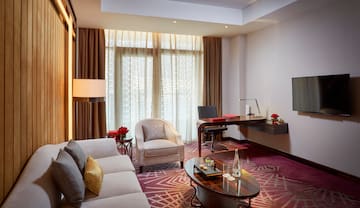 a room with a desk and a couch