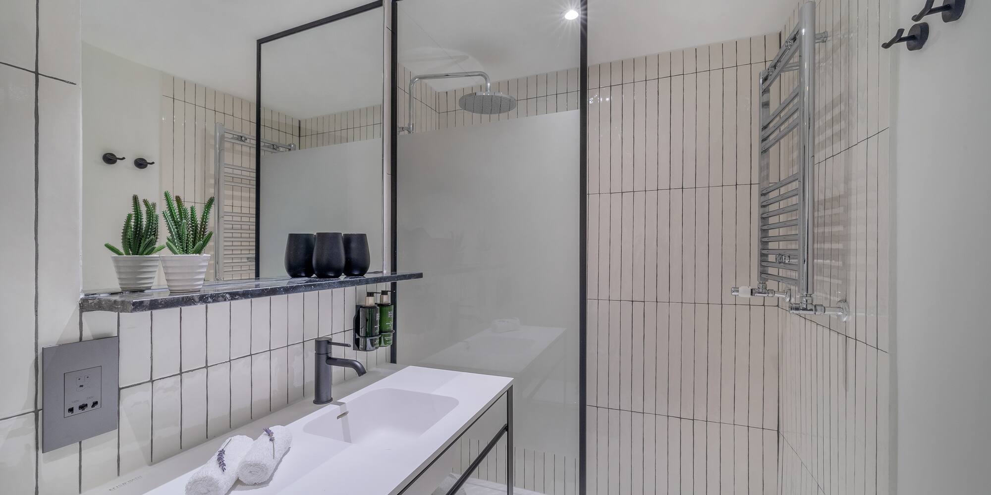 a bathroom with a shower and sink