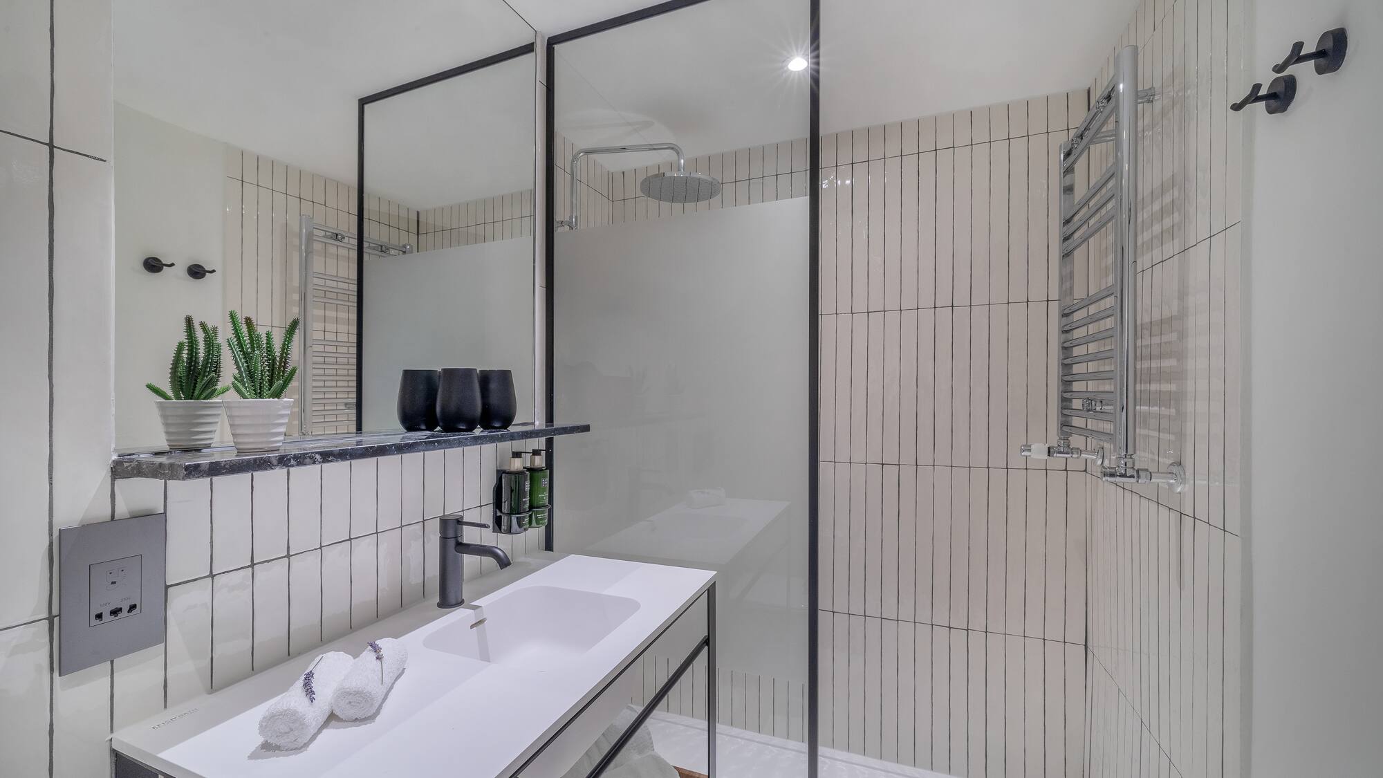 a bathroom with a shower and sink