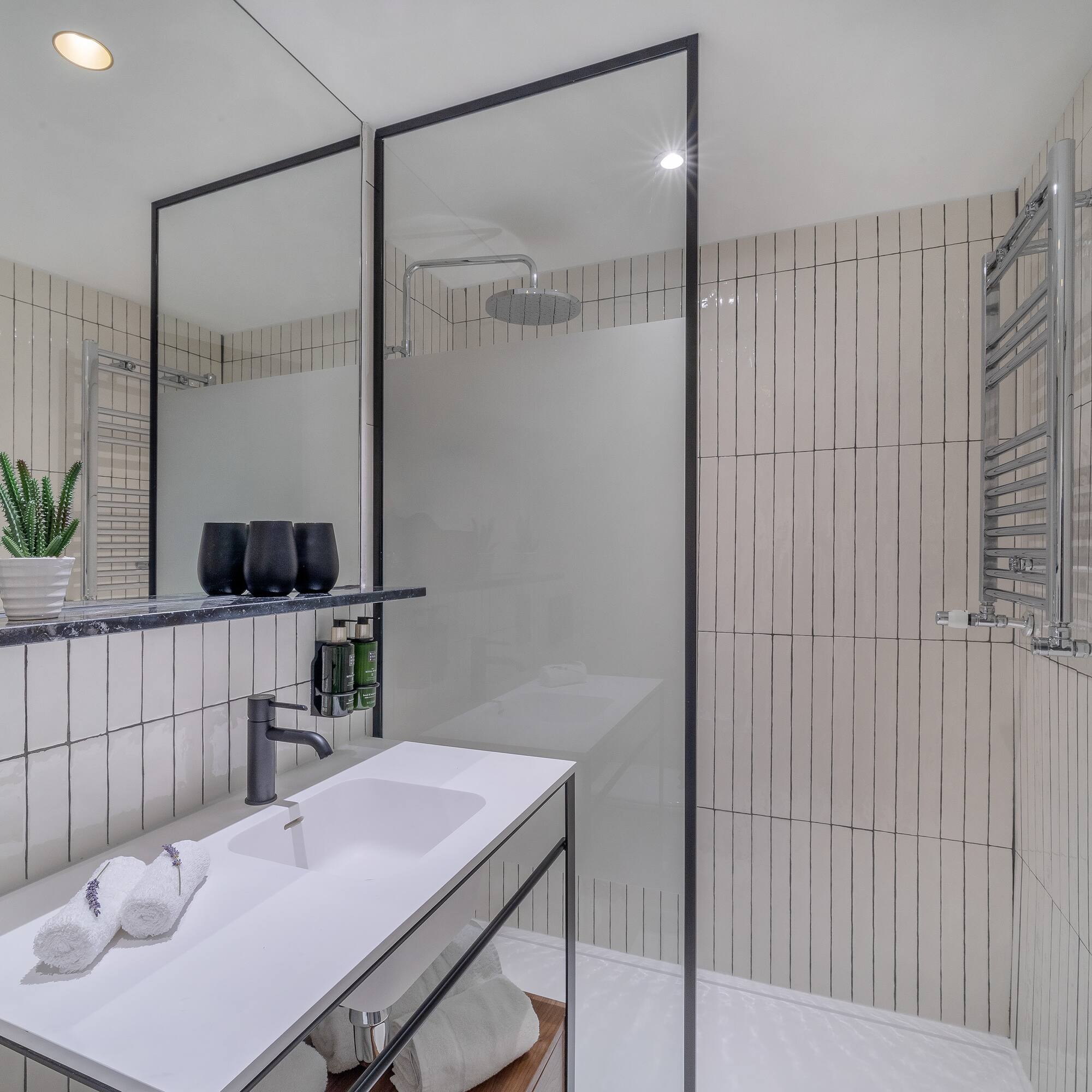 a bathroom with a shower and sink