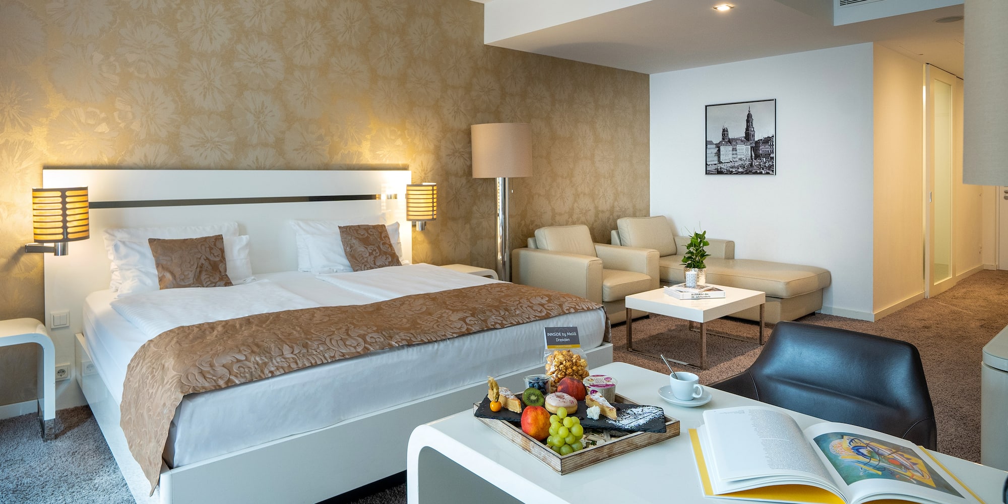 a hotel room with a bed and a table