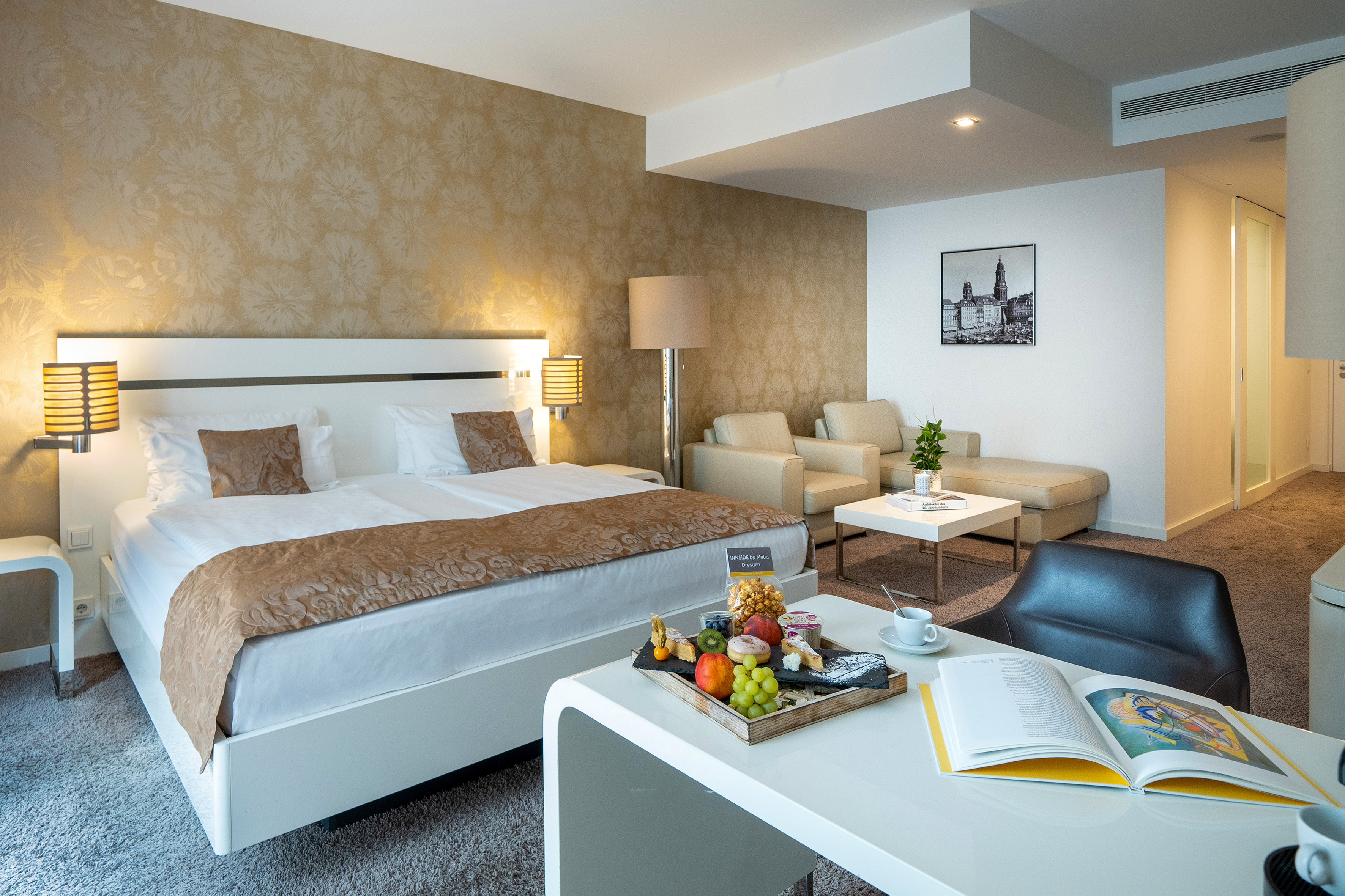 a hotel room with a bed and a table