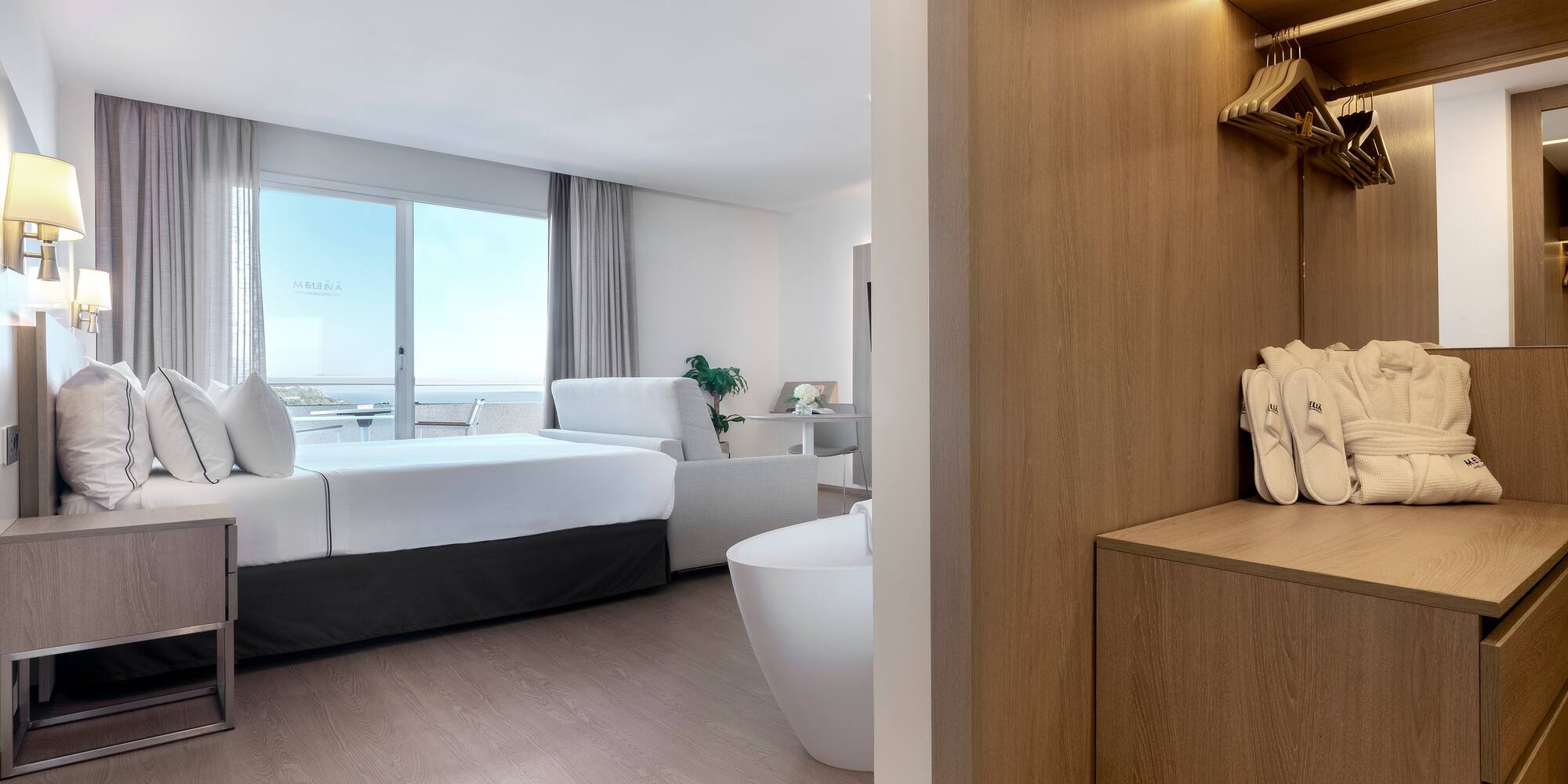 a room with a bed and bathtub