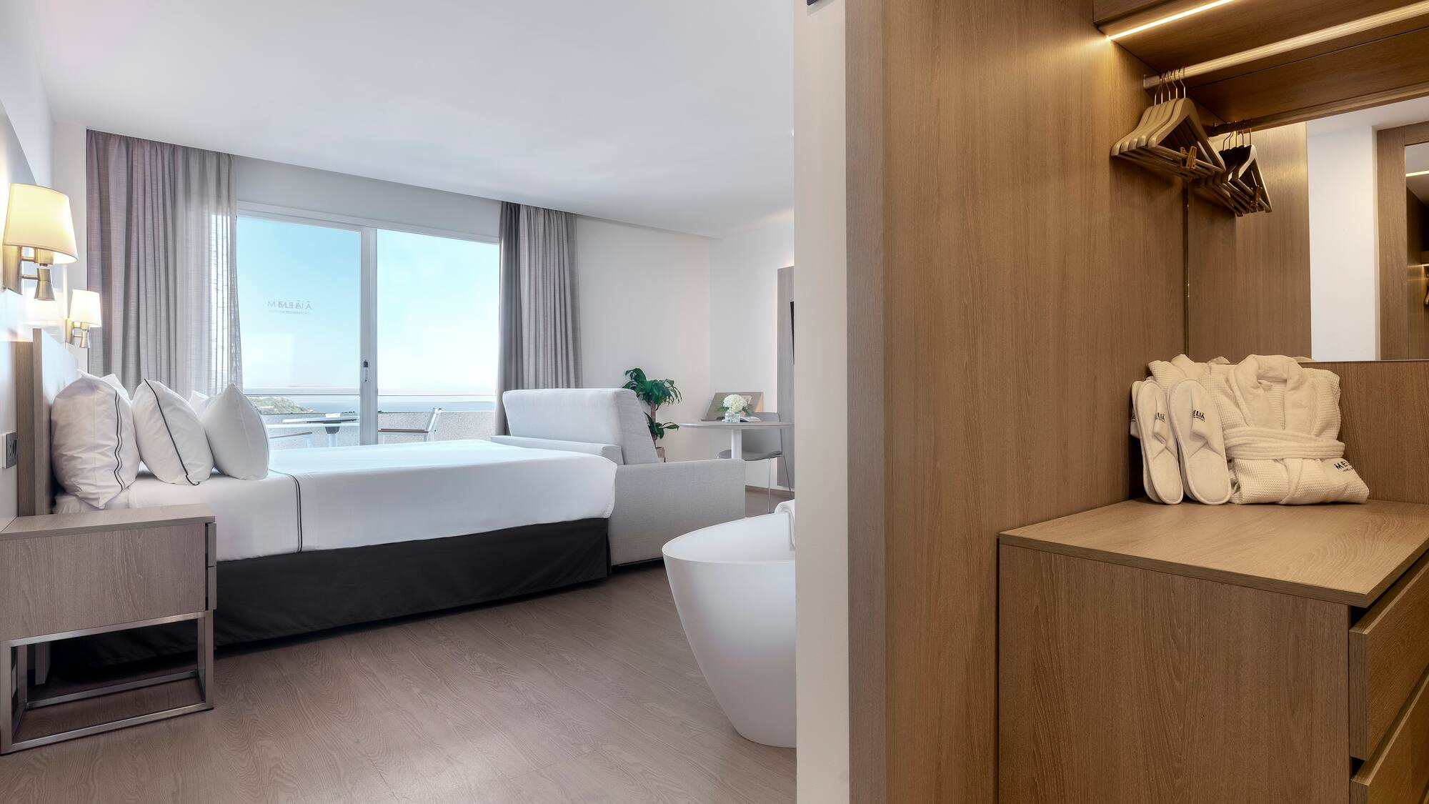 a room with a bed and bathtub