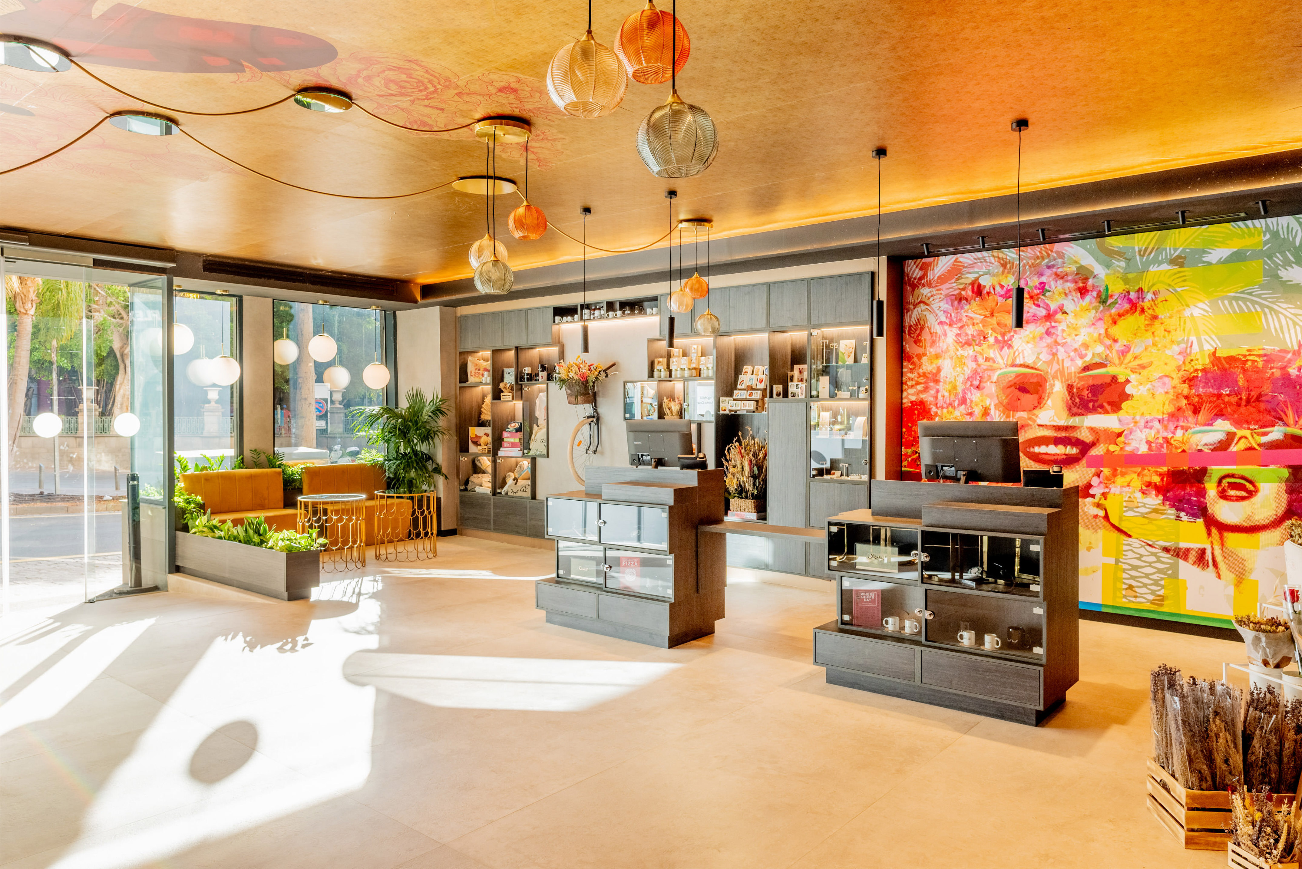 a room with a large window and a large wall with shelves and lamps