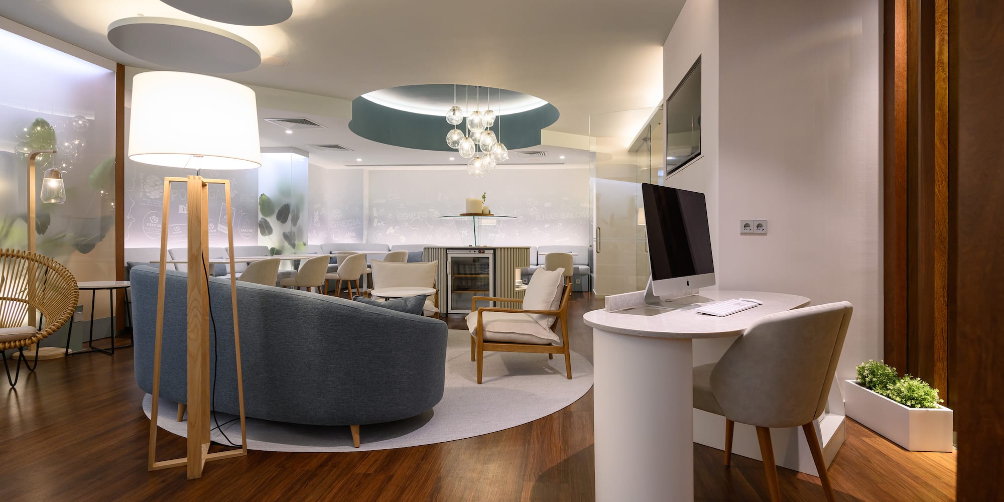 a room with a computer and furniture