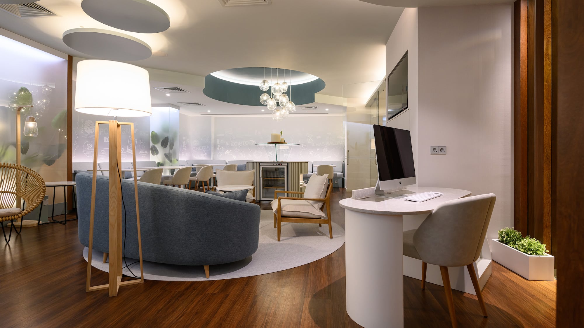 a room with a computer and furniture