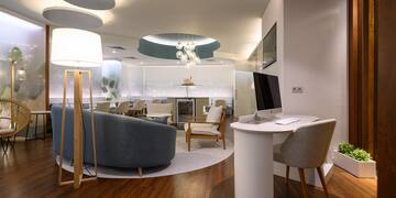 a room with a computer and furniture