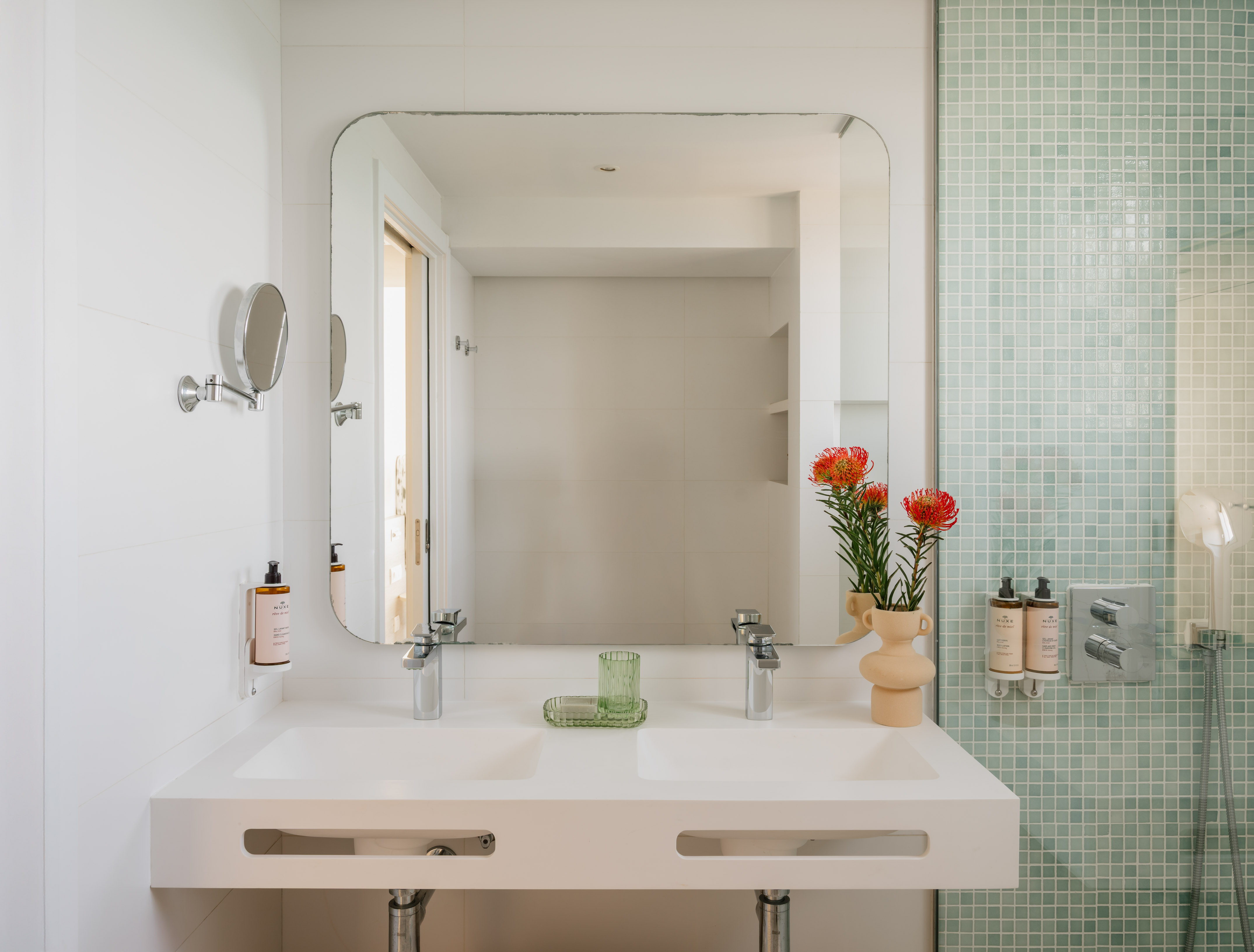 a bathroom with a mirror and sink