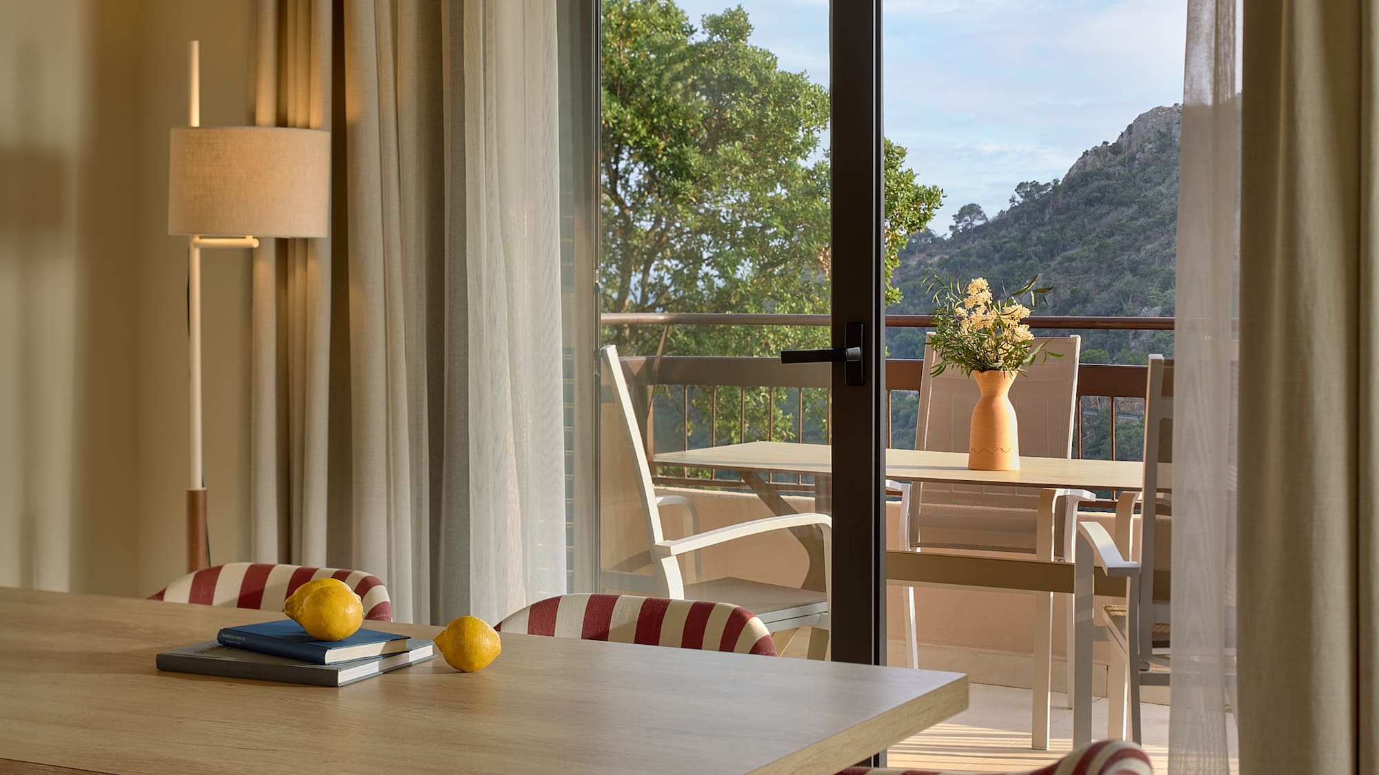 a room with a table and chairs and a table and chairs