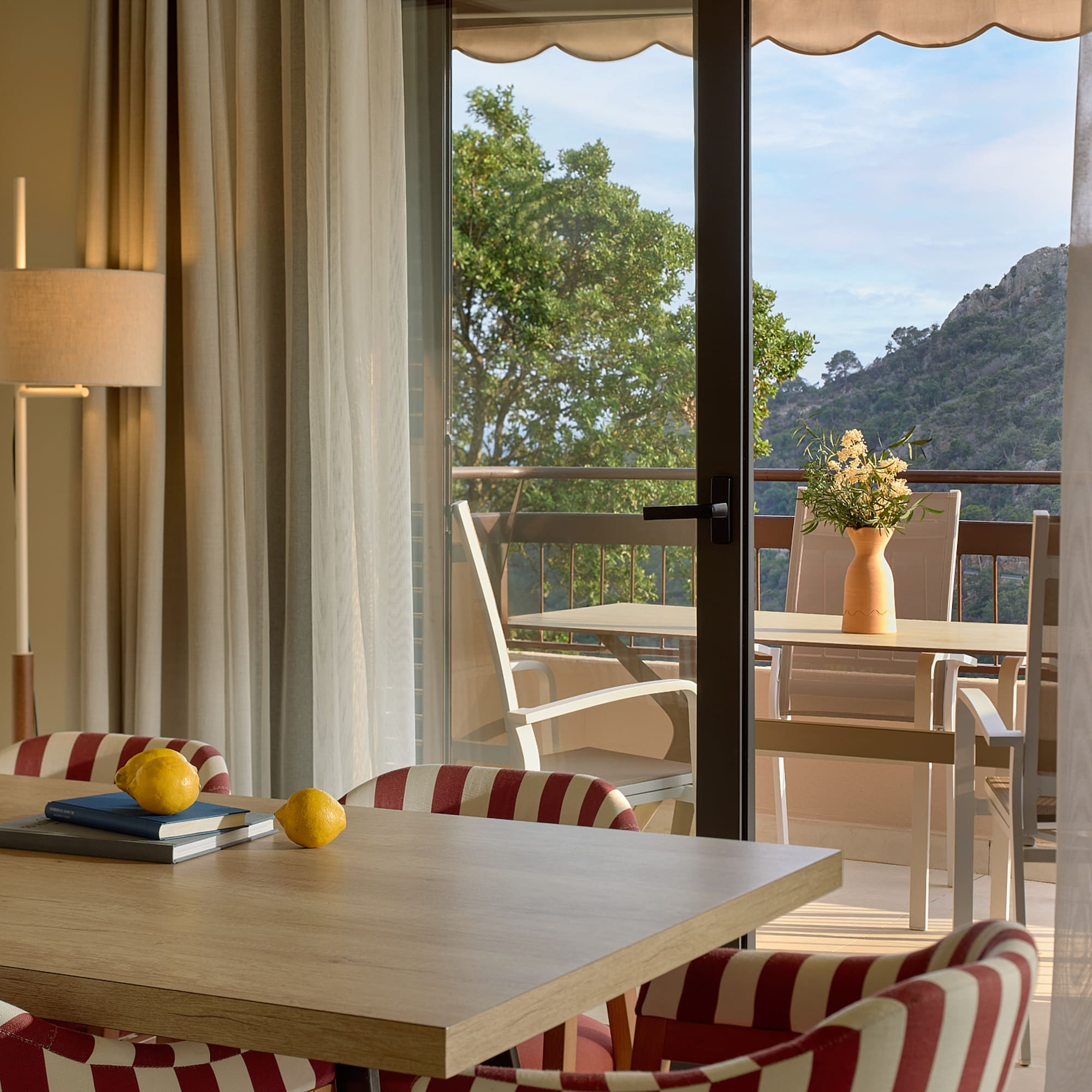 a room with a table and chairs and a table and chairs