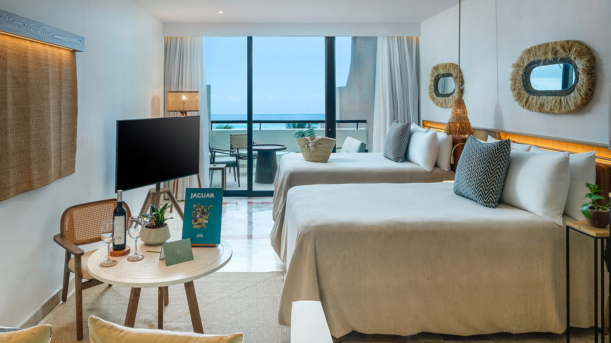 a room with two beds and a television