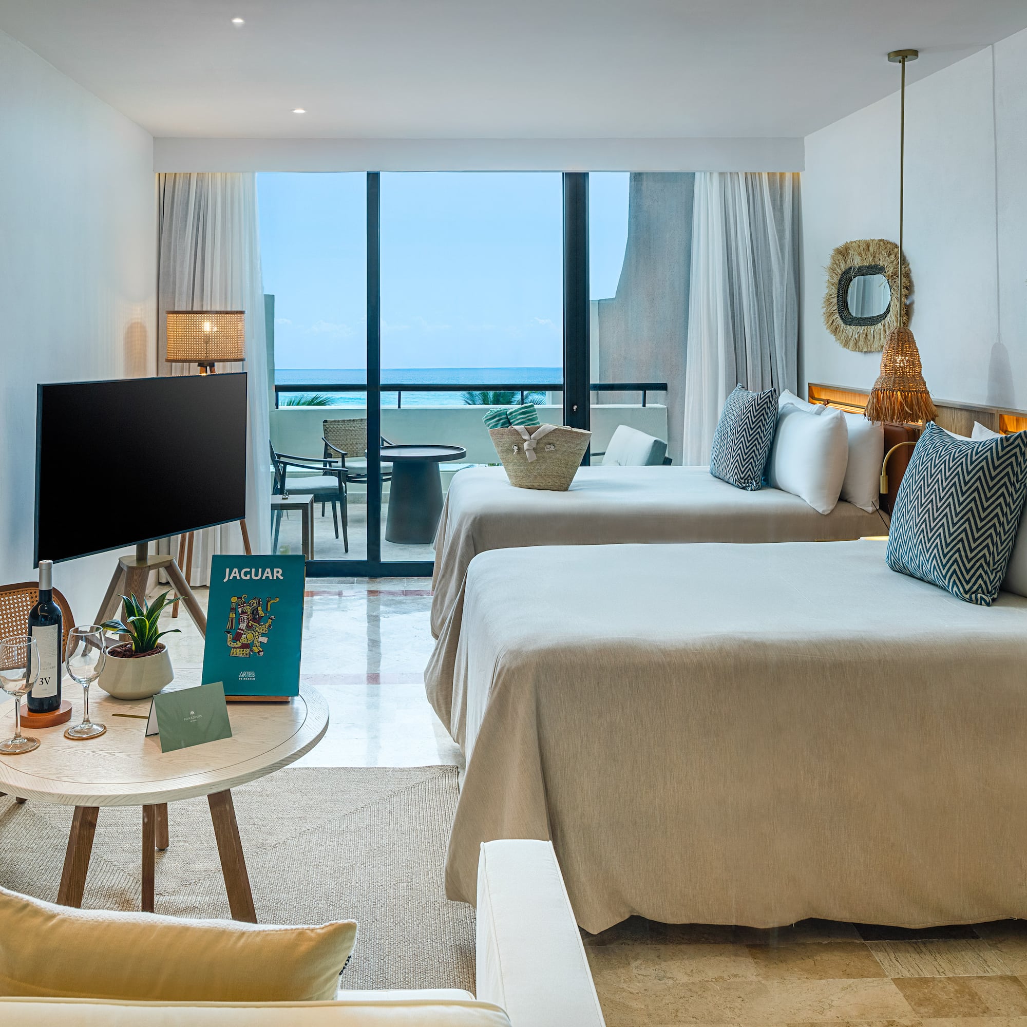 a room with two beds and a television