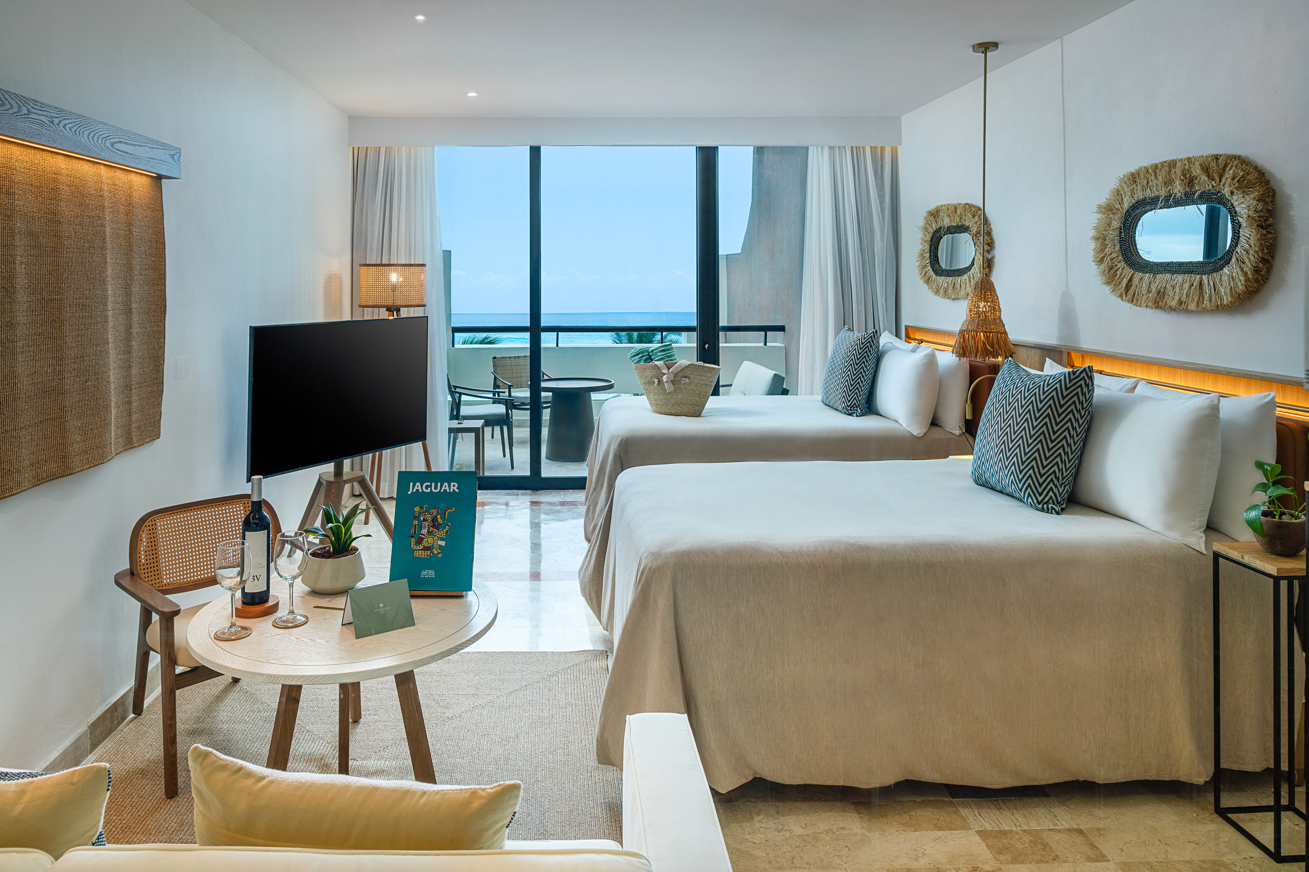 a room with two beds and a television