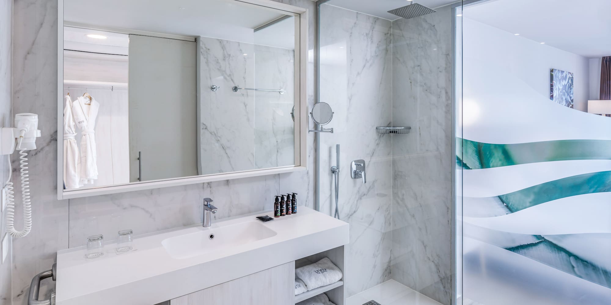 a bathroom with a shower and sink