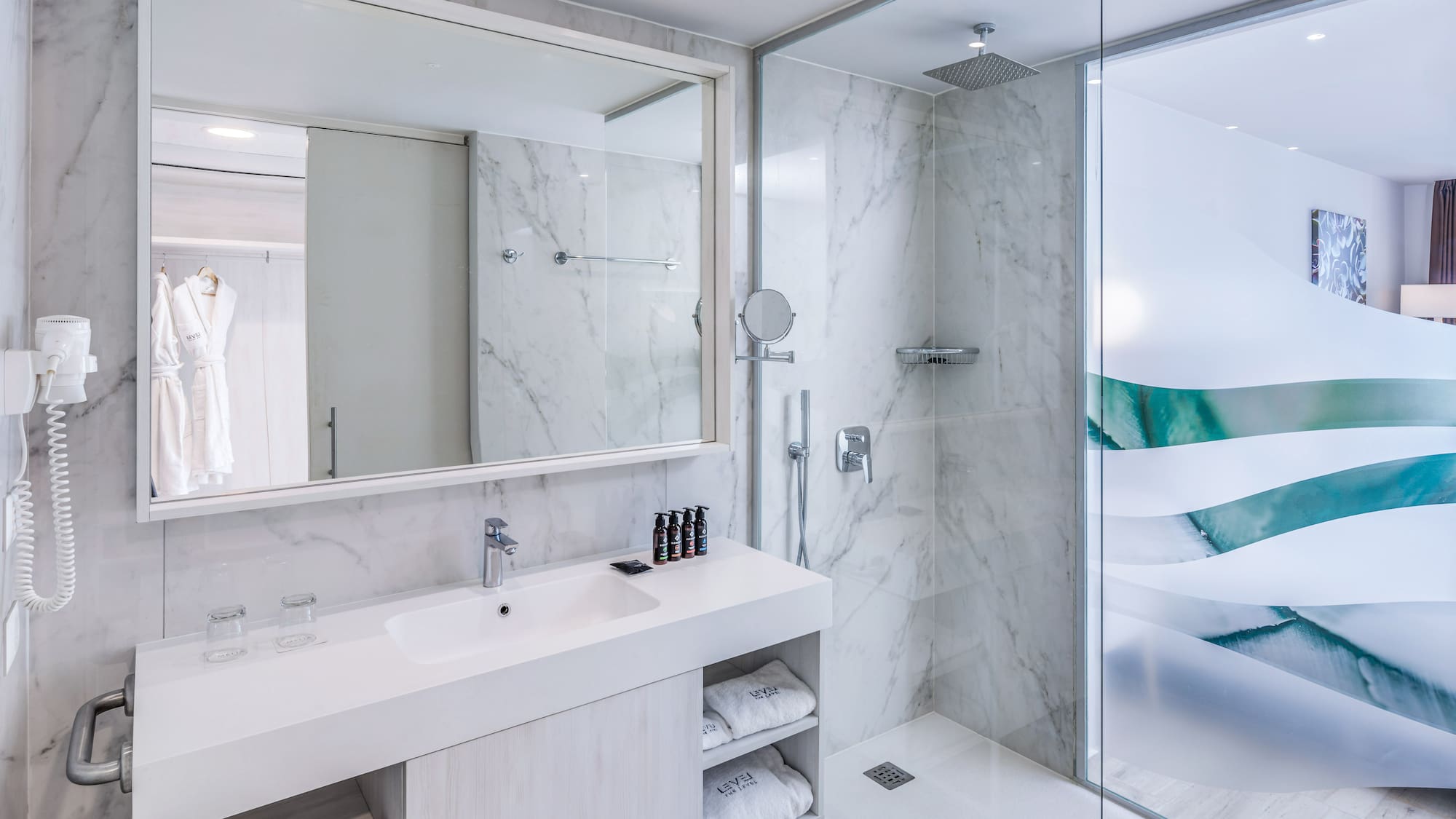 a bathroom with a shower and sink