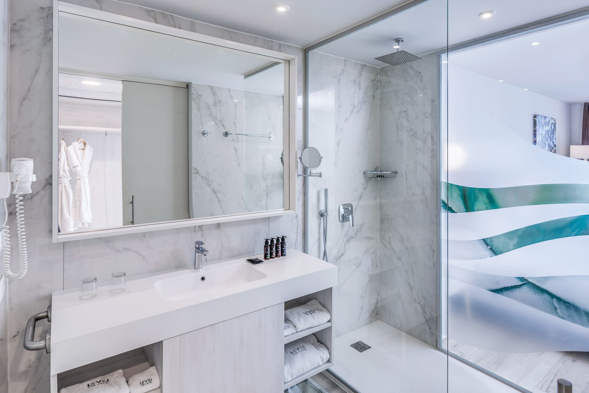 a bathroom with a shower and sink