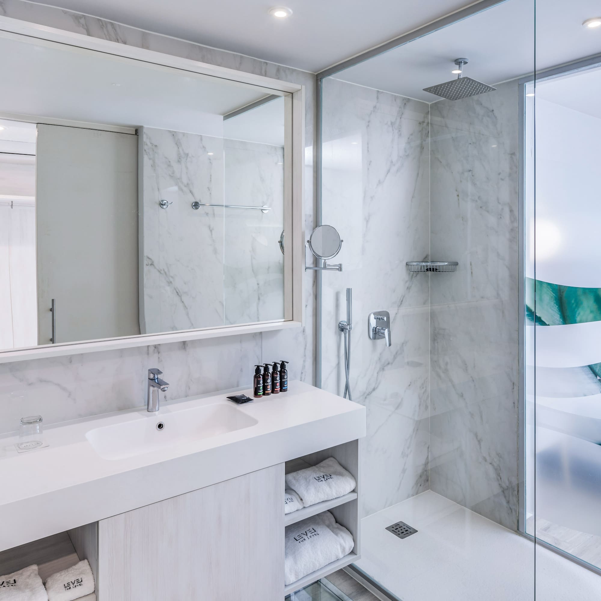 a bathroom with a shower and sink