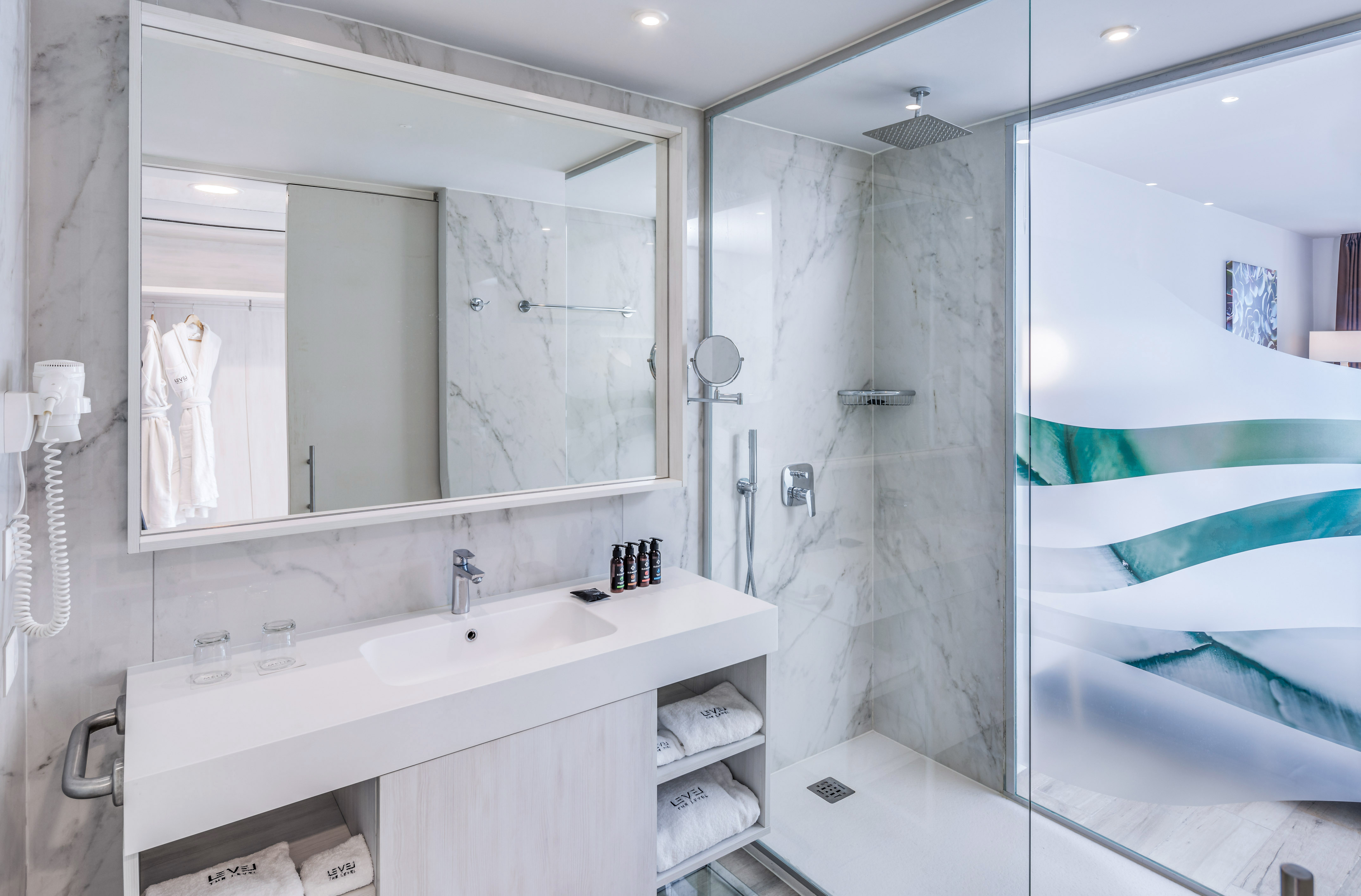 a bathroom with a shower and sink