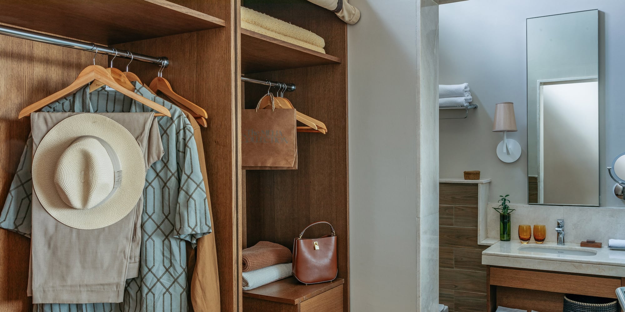 Wood wardrobe with resort wear and contemporary bathroom vanity area.