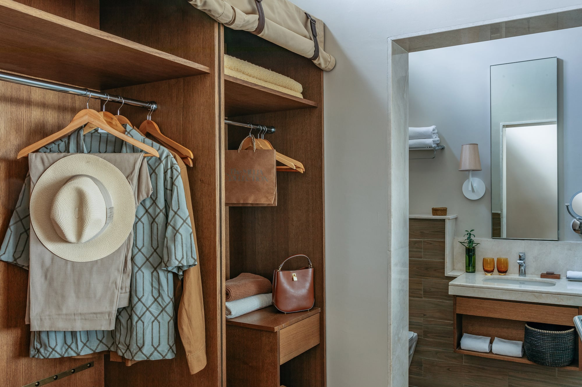 Wood wardrobe with resort wear and contemporary bathroom vanity area.