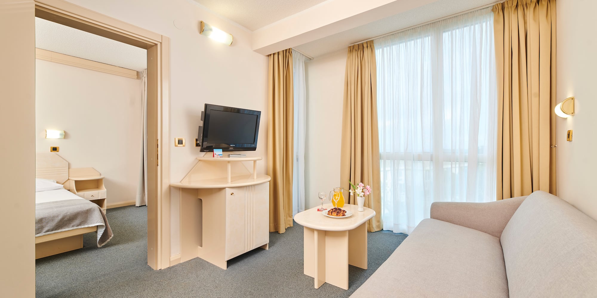 a room with a television and a couch