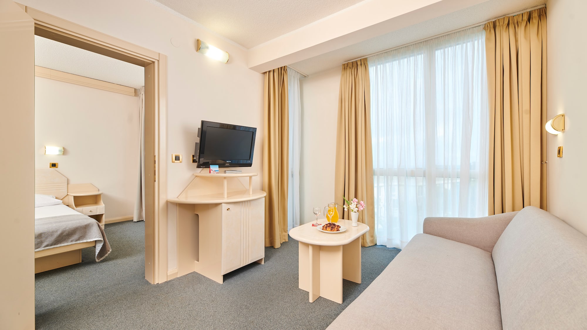 a room with a television and a couch